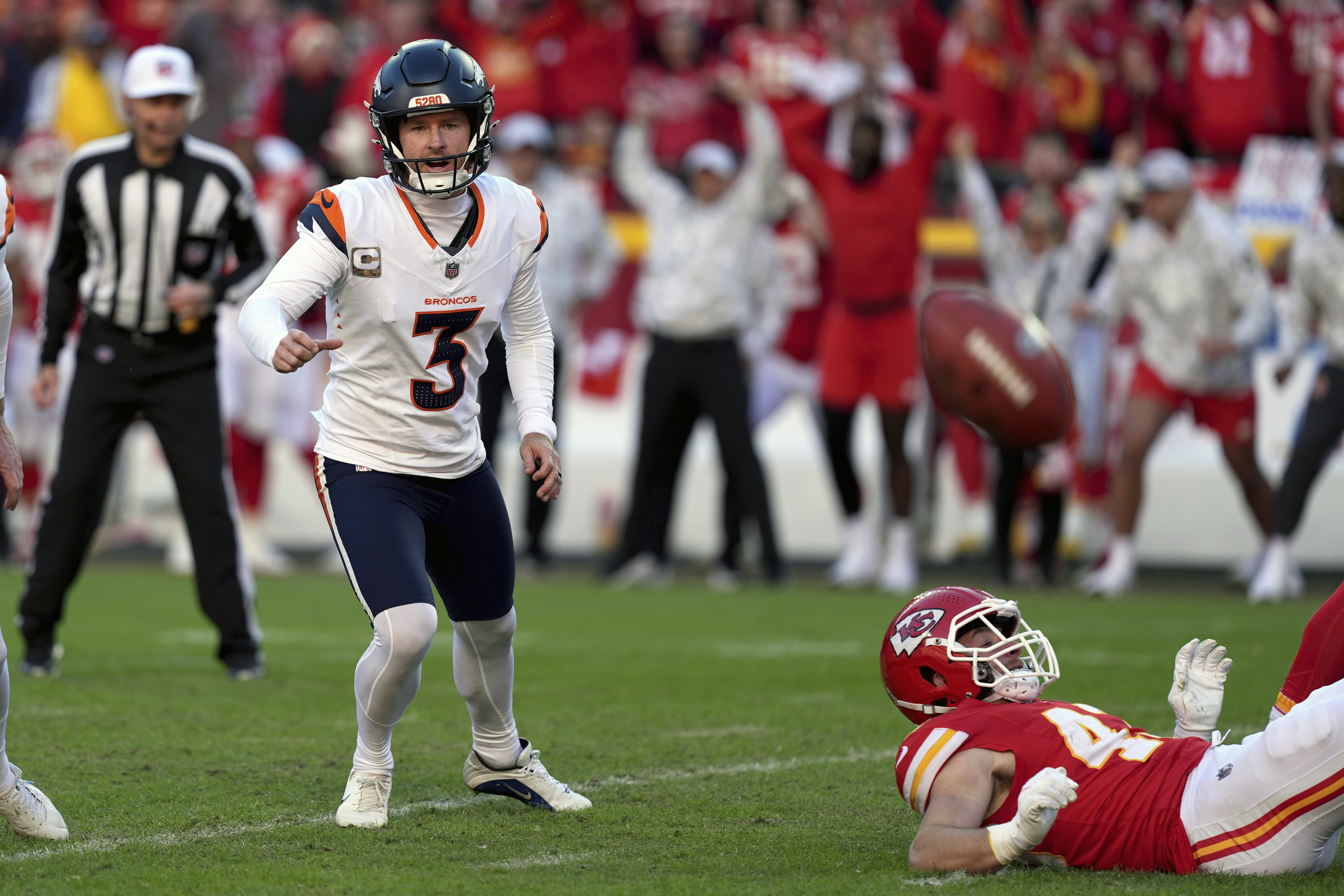 Denver Broncos kicker Wil Lutz (3) chases after the ball after his last-second field goal attempt was blocked during the second half of an NFL football game against the Kansas City Chiefs Sunday, Nov. 10, 2024, in Kansas City, Mo. The Chiefs won 16-14.