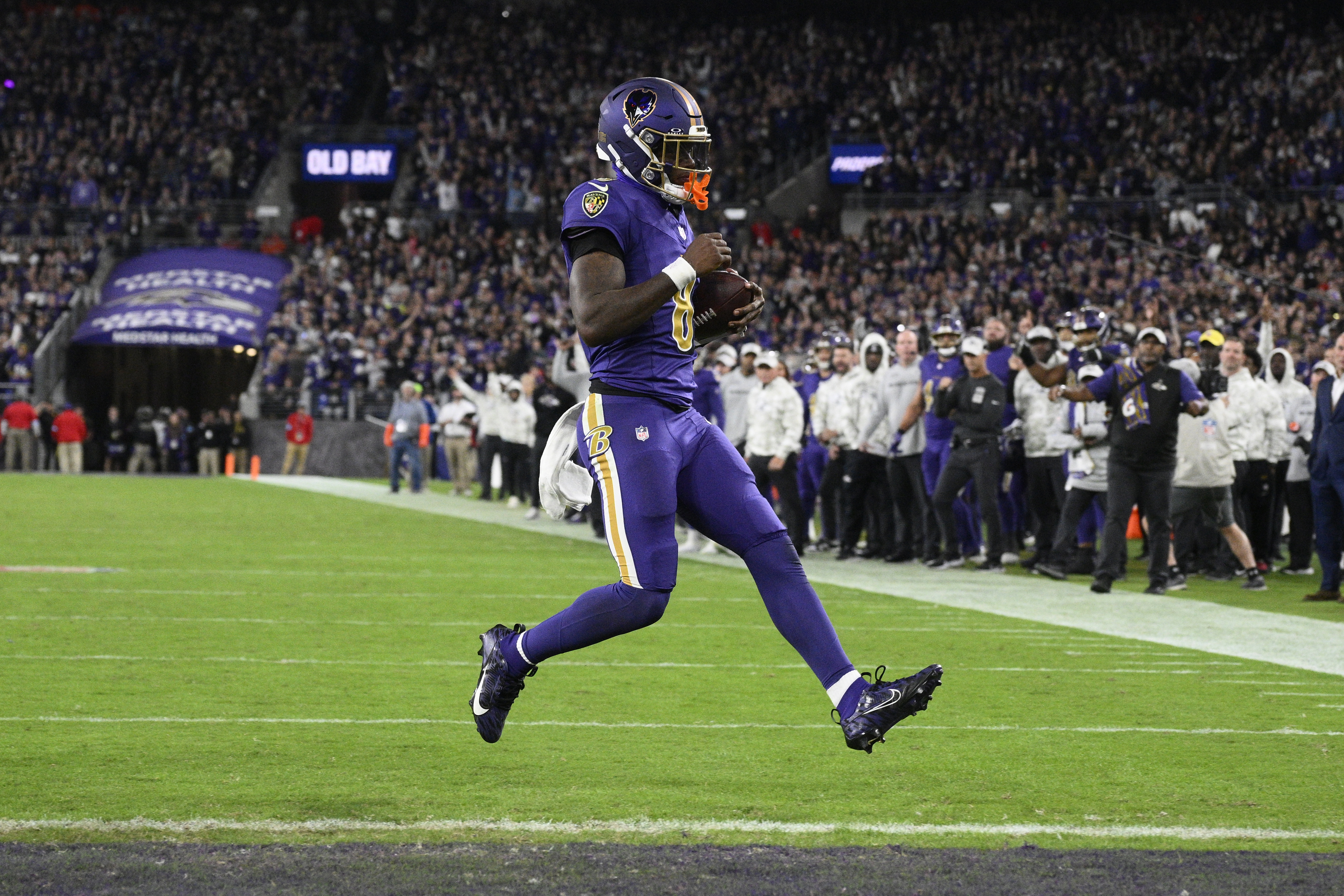 Baltimore Ravens quarterback Lamar Jackson scores a two-point conversion during the second half of an NFL football game against the Cincinnati Bengals, Thursday, Nov. 7, 2024, in Baltimore.