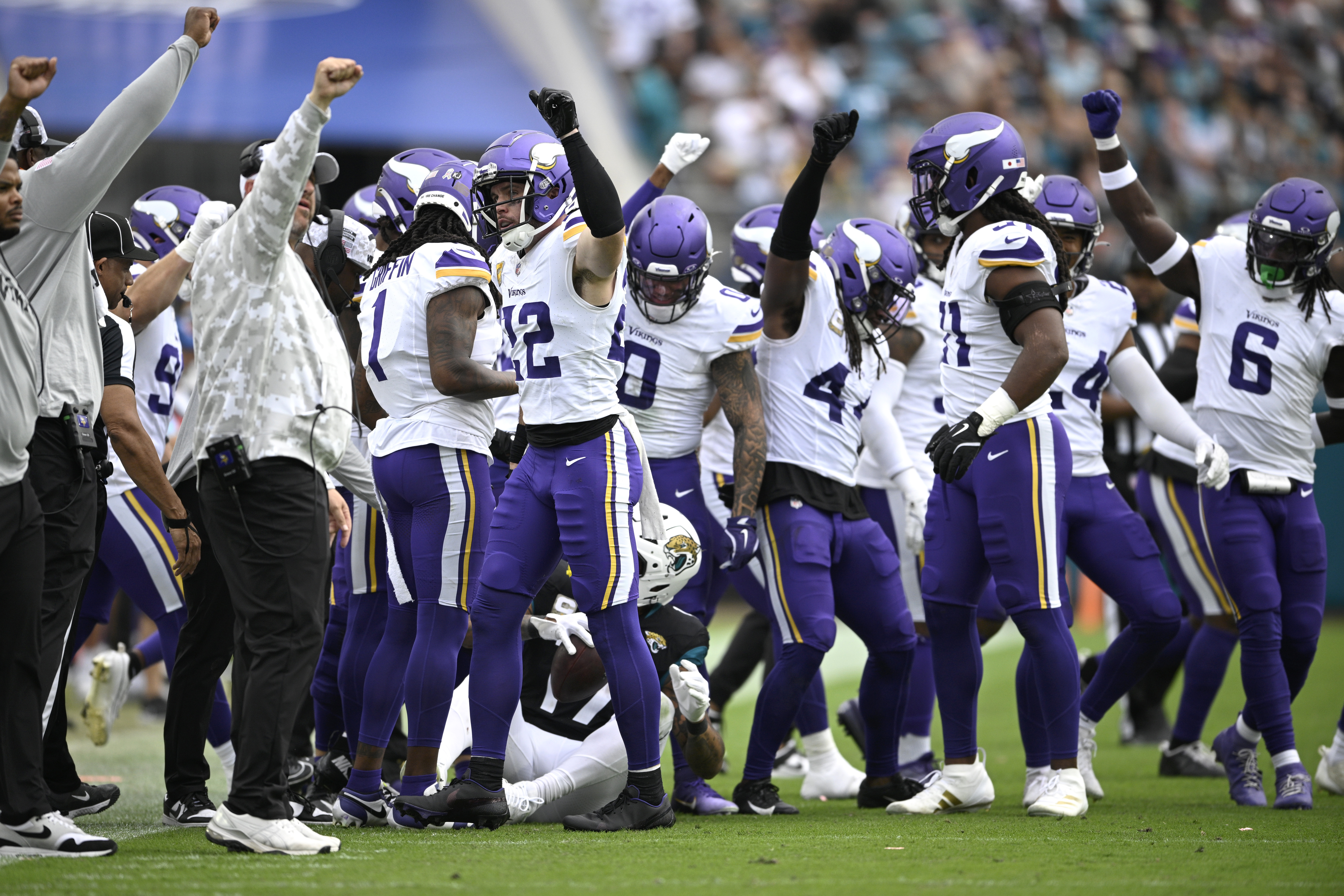 Minnesota Vikings celebrate a defensive stop after tackling Jacksonville Jaguars tight end Evan Engram (17) during the second half of an NFL football game, Sunday, Nov. 10, 2024, in Jacksonville, Fla.