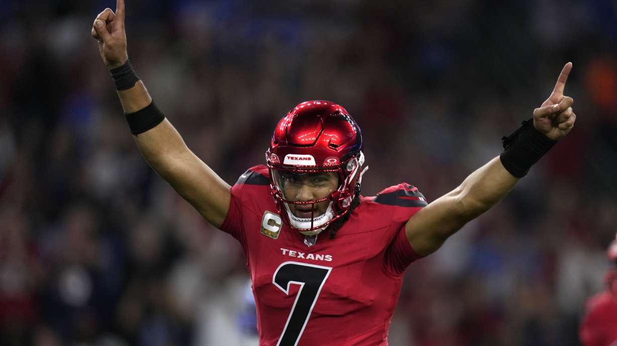 Houston Texans quarterback C.J. Stroud celebrates after throwing a touchdown pass during the first half of an NFL football game against the Detroit Lions, Sunday, Nov. 10, 2024, in Houston.