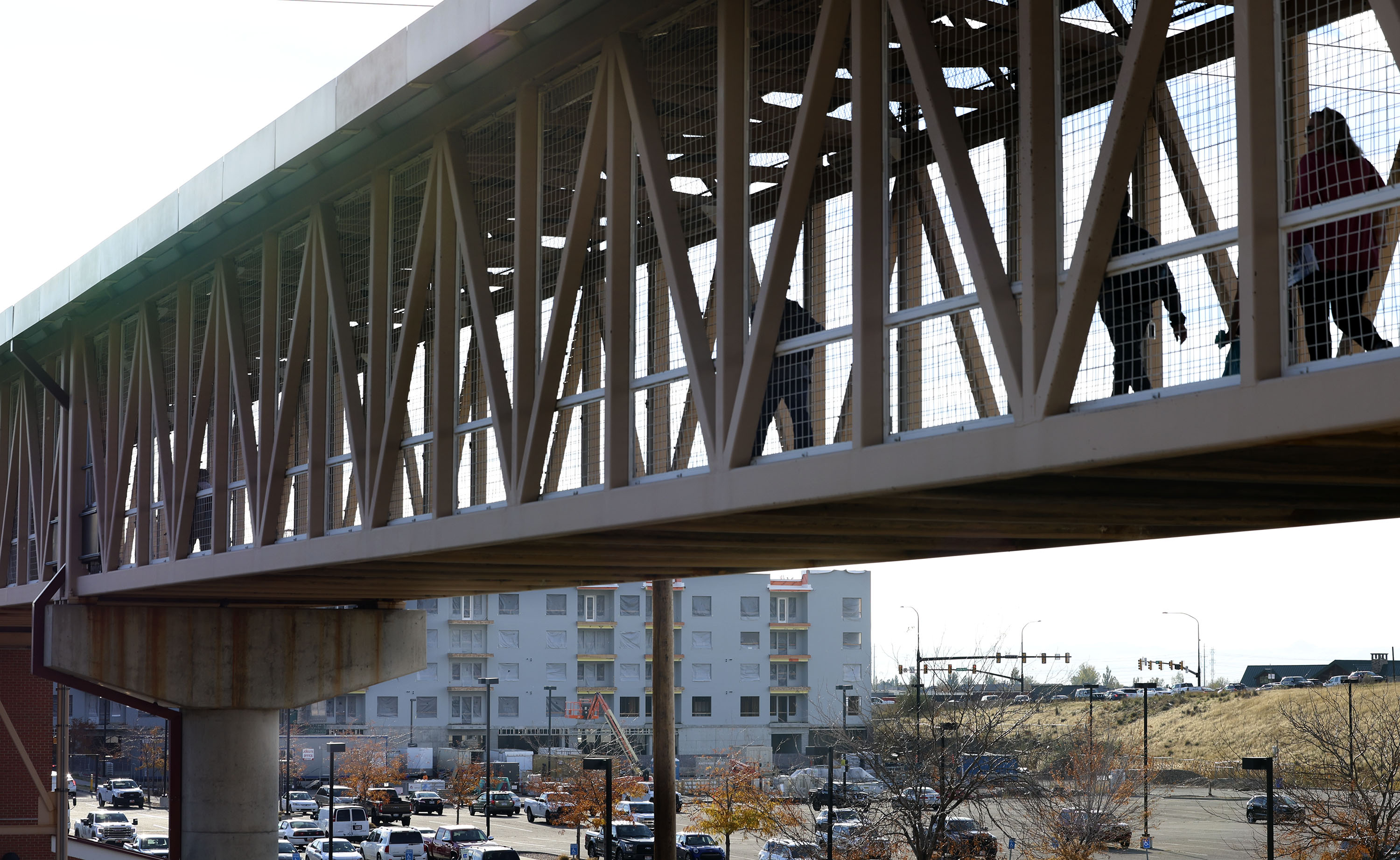 People use the pedestrian bridge in Farmington on Oct. 31, 2022. UDOT will be installing a pedestrian bridge on Bangerter Highway and 9800 South.