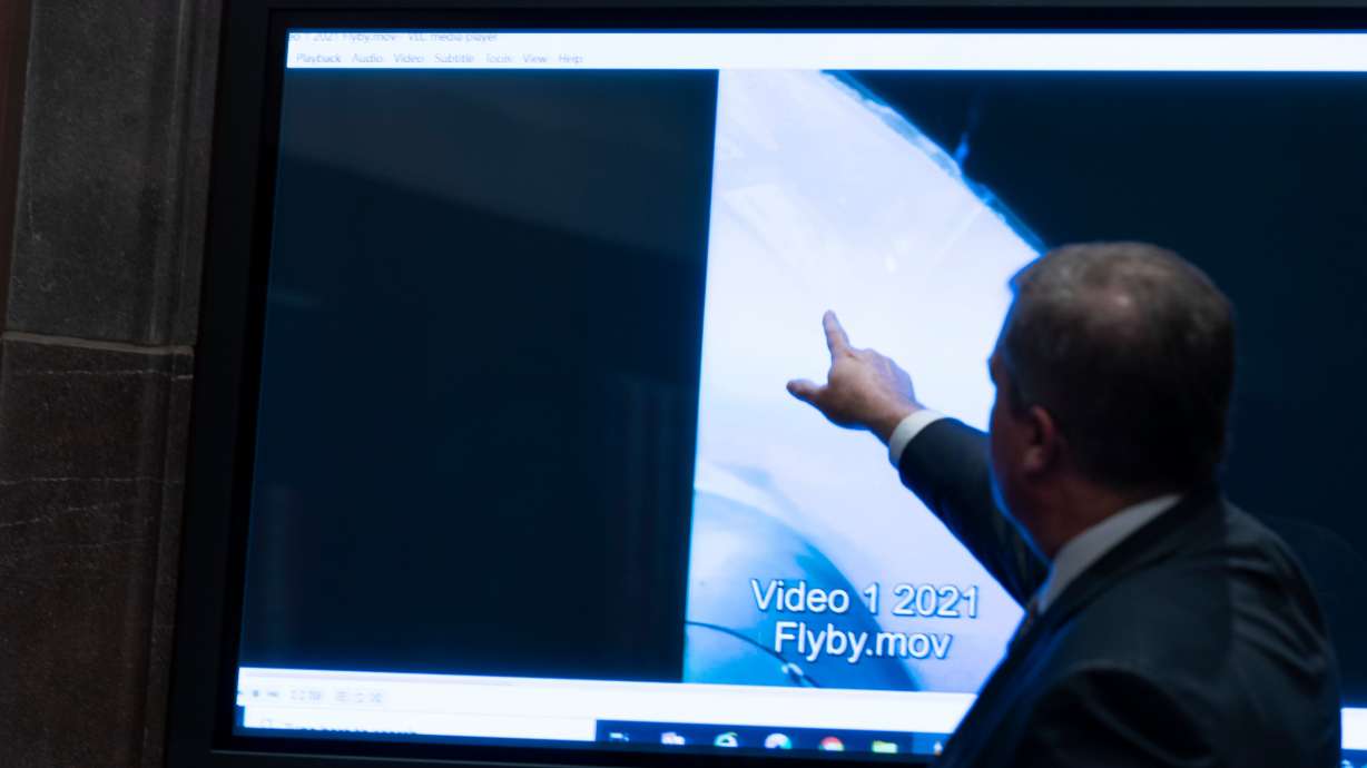 Deputy Director of Naval Intelligence Scott Bray points to a video display of a unexplained aerial phenomena House committee hearing on Capitol Hill, May 17, 2022, in Washington.