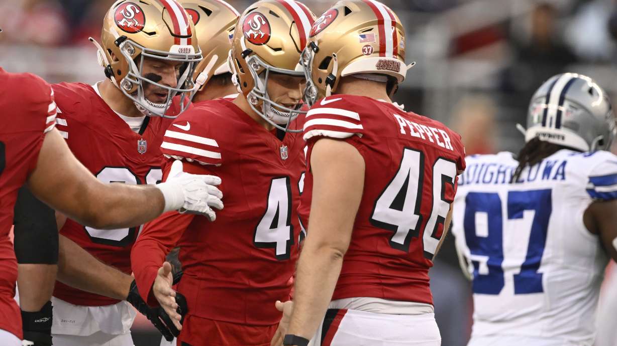 San Francisco 49ers place kicker Anders Carlson, middle left, celebrates with long snapper Taybor Pepper (46) after kicking a field goal during the first half of an NFL football game against the Dallas Cowboys in Santa Clara, Calif., Sunday, Oct. 27, 2024.
