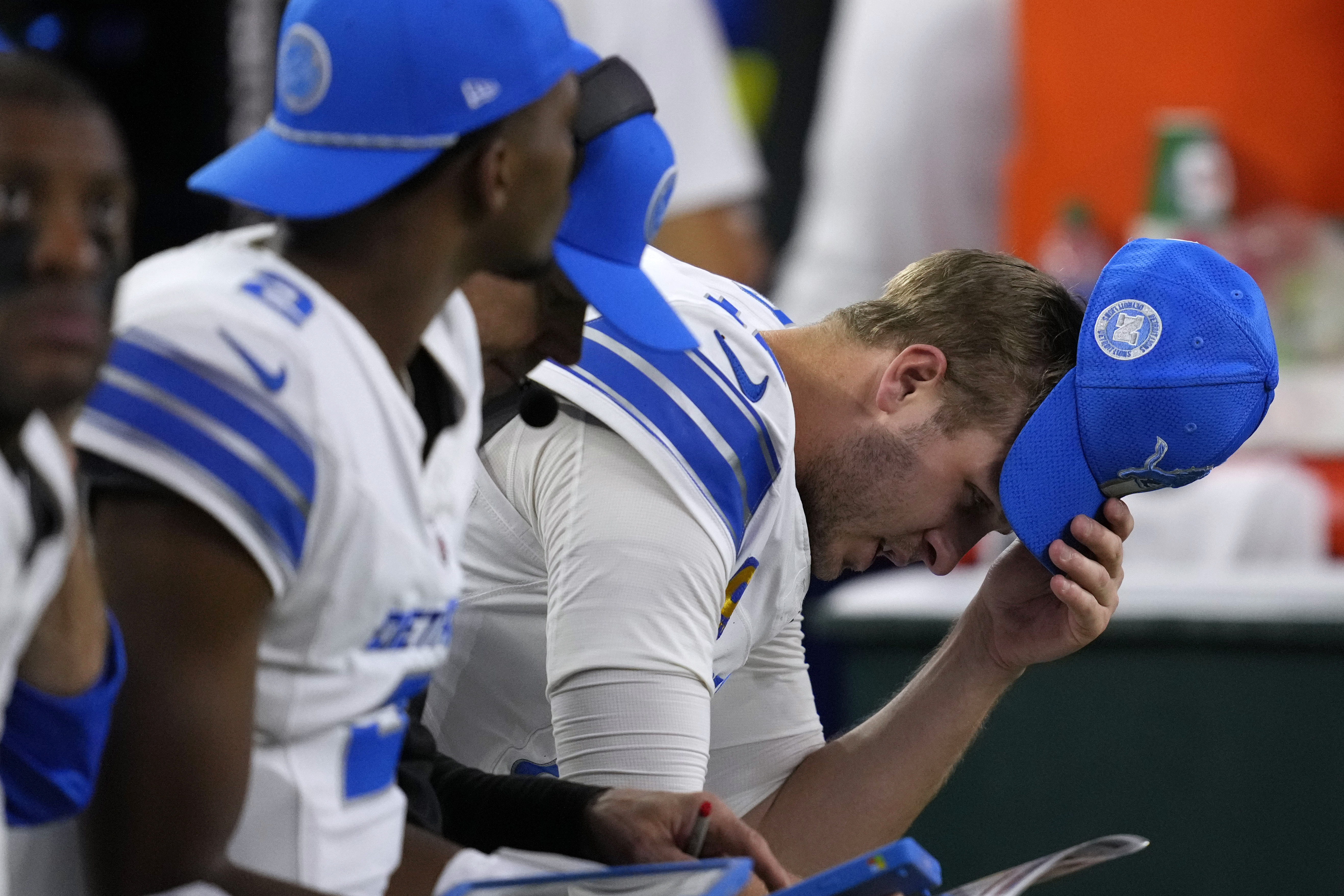 Detroit Lions quarterback Jared Goff reacts on the bench after throwing an interception during the second half of an NFL football game against the Houston Texans, Sunday, Nov. 10, 2024, in Houston.