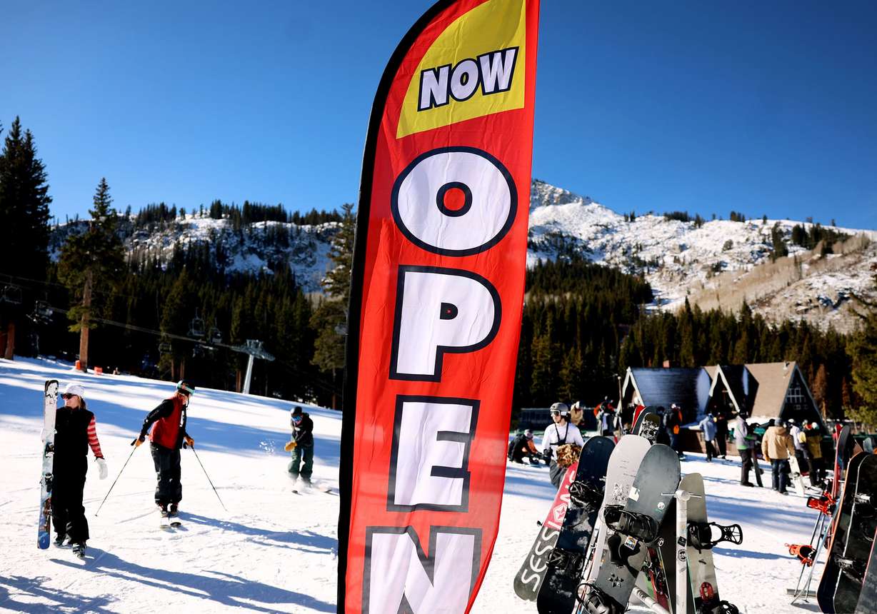 People ski and snowboard at the grand opening of the season at Brighton Resort in Big Cottonwood Canyon on Thursday.