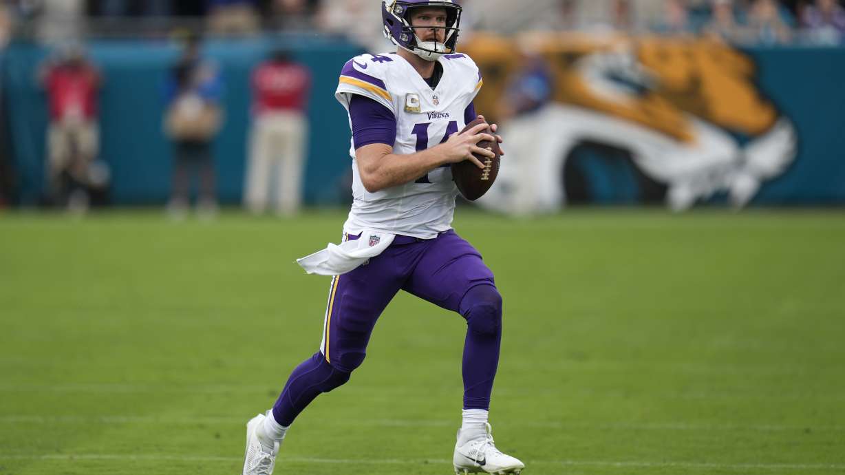 Minnesota Vikings quarterback Sam Darnold (14) runs with the football during the first half of an NFL football game against the Jacksonville Jaguars, Sunday, Nov. 10, 2024, in Jacksonville, Fla.