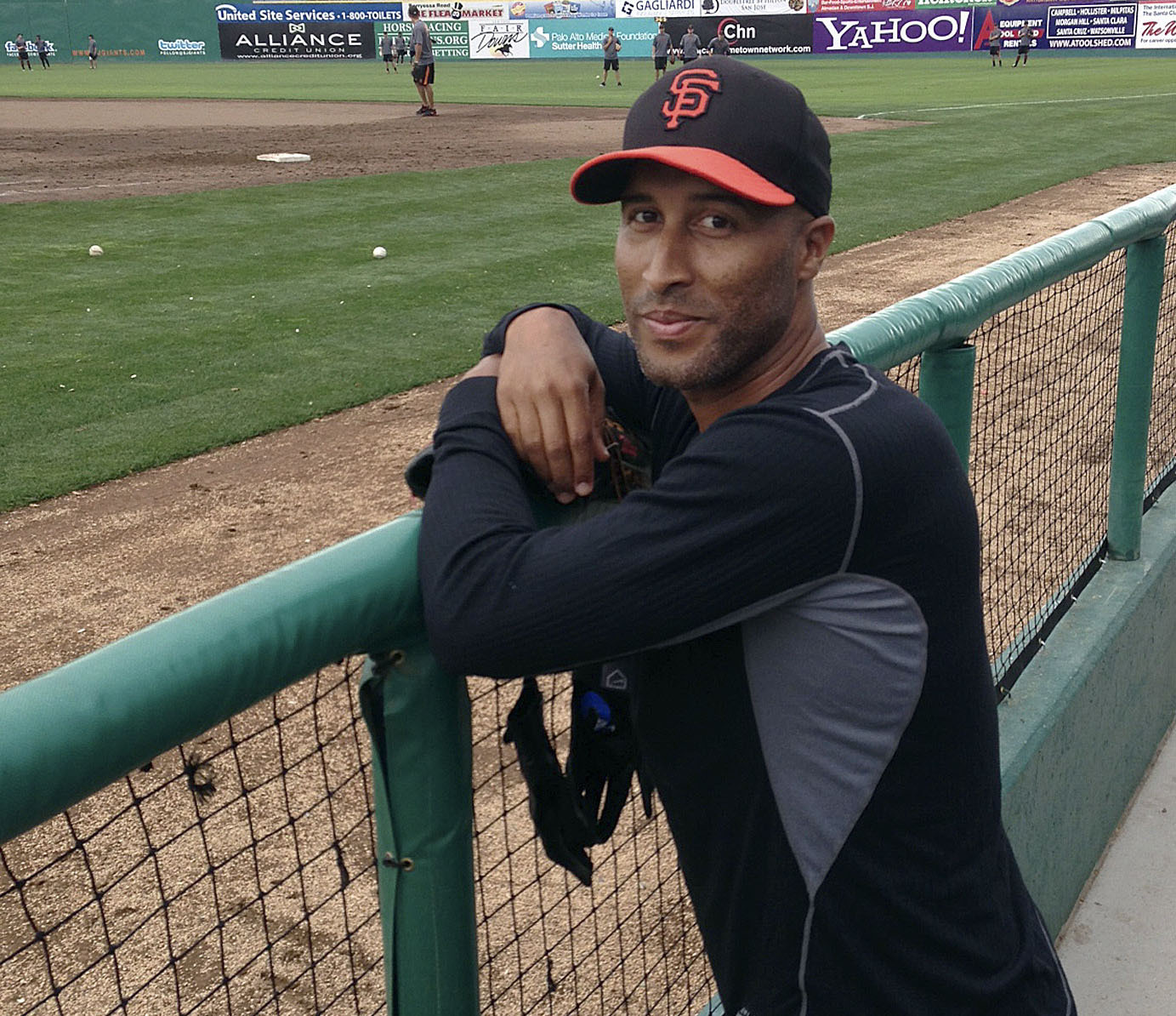 FILE - Former San Francisco Giants outfielder Randy Winn poses for photos in the dugout at Municipal Stadium before a Class-A minor league baseball game between the San Jose Giants and the Modesto Nuts in San Jose, Calif., June 24, 2013.
