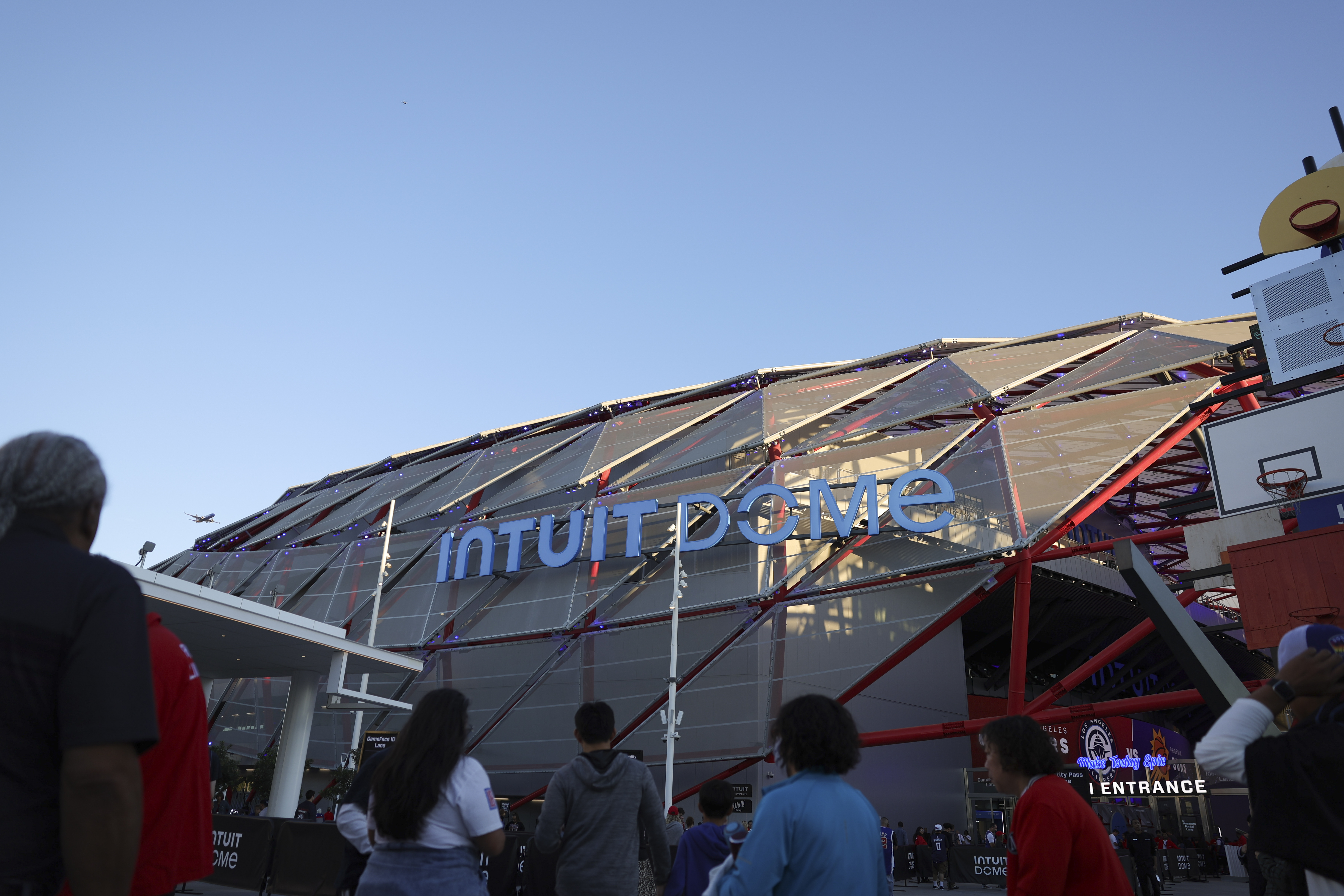Fans line up at the Intuit Dome before an NBA basketball game between the Los Angeles Clippers and the Phoenix Suns, Wednesday, Oct. 23, 2024, in Inglewood, Calif.
