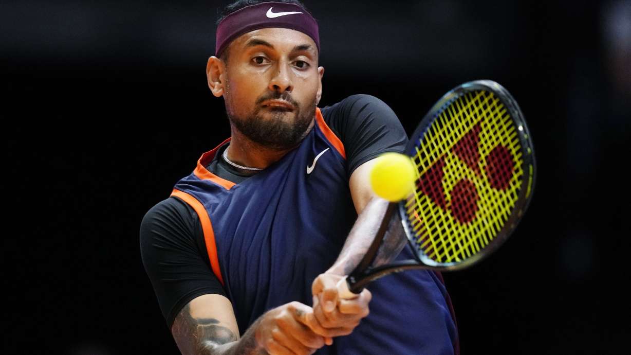 FILE - Nick Kyrgios of Eagles returns the ball to Grigor Dimitrov of Falcons during a match of Day 3 of the World Tennis League at Coca-Cola Arena in Dubai, United Arab Emirates, on Dec. 21, 2022.