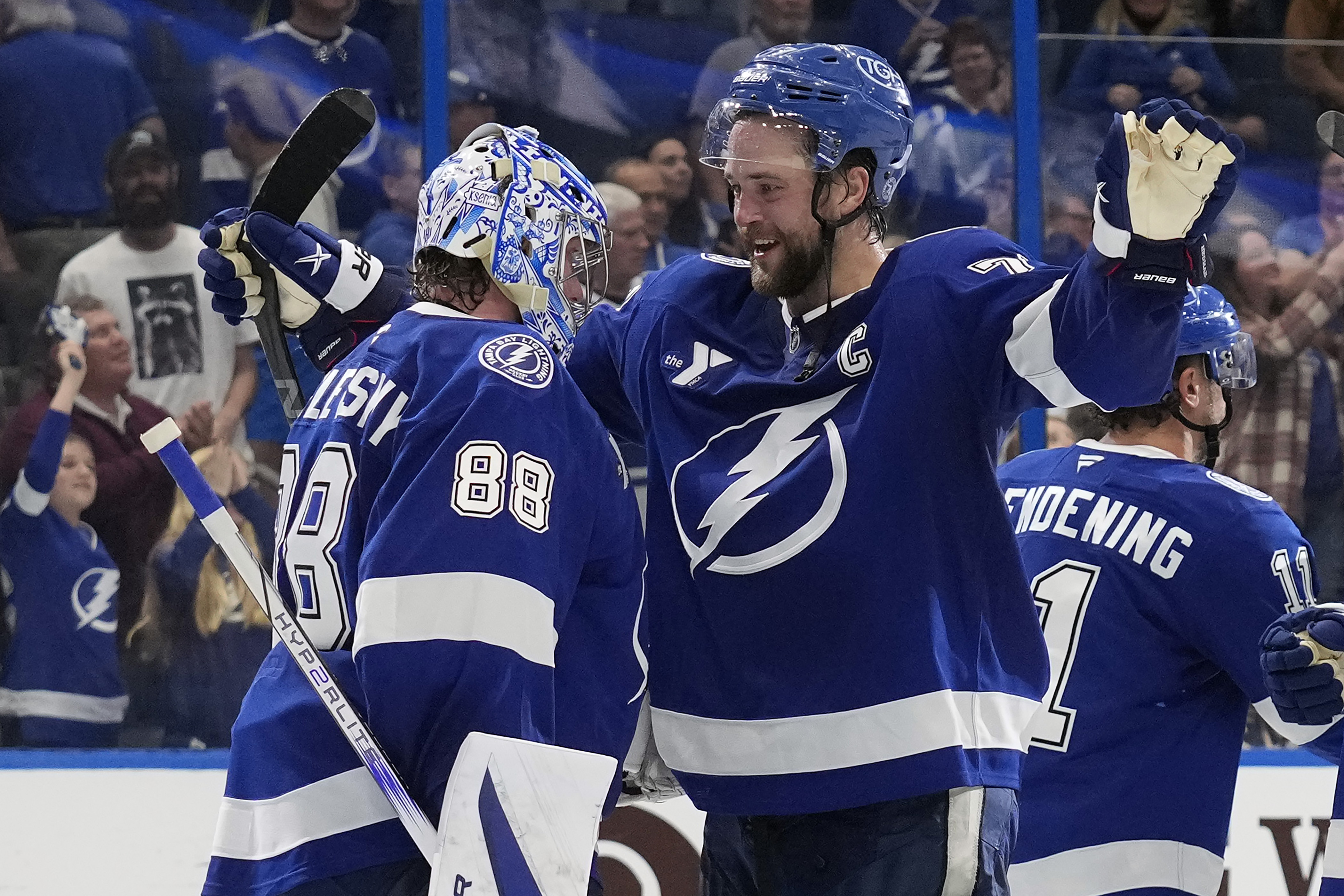 Tampa Bay Lightning defenseman Victor Hedman (77) hugs goaltender Andrei Vasilevskiy (88) after Vasilevskiy picked up his 300th career win during an NHL hockey game against the Winnipeg Jets Thursday, Nov. 14, 2024, in Tampa, Fla.