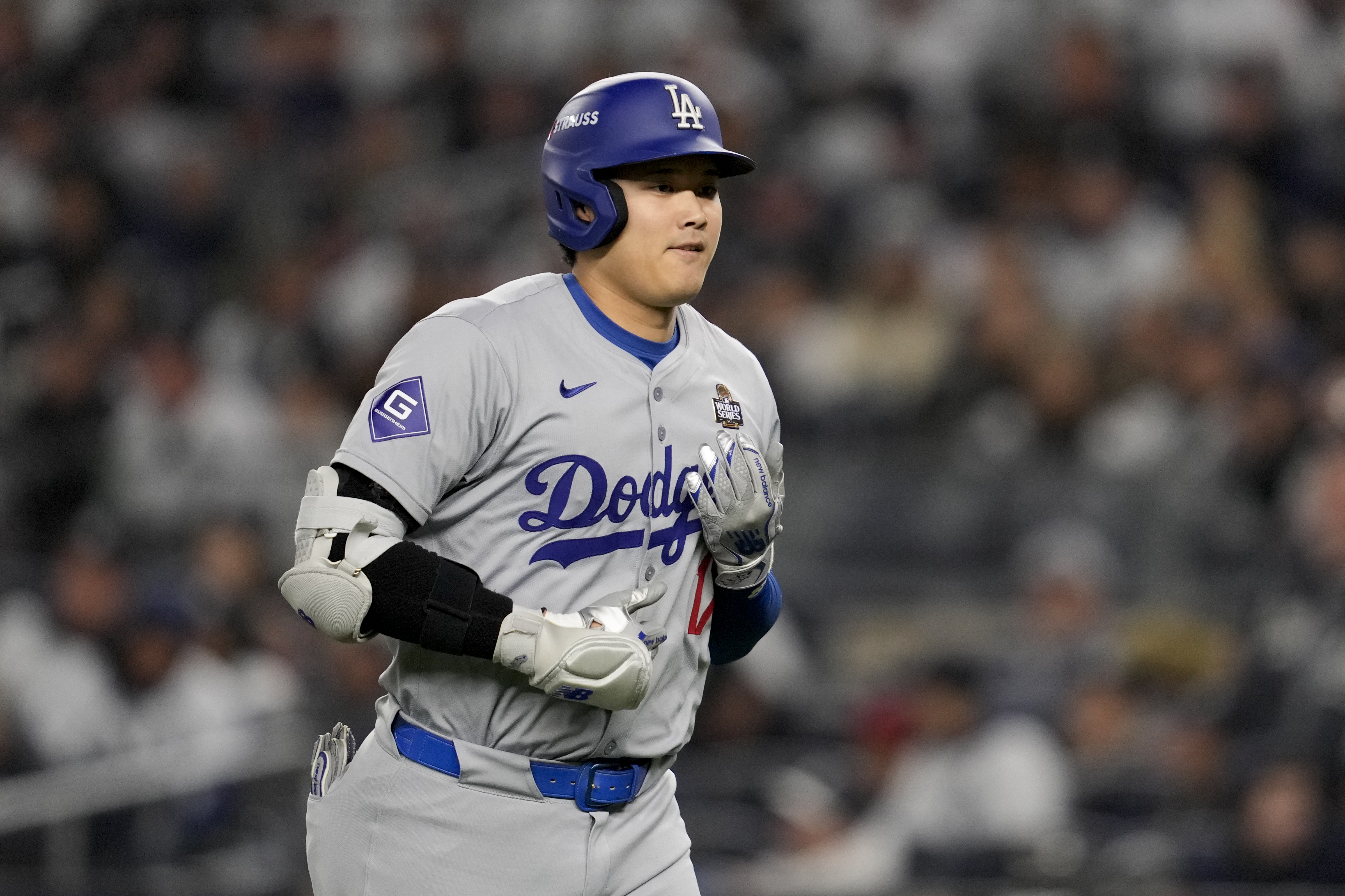 Los Angeles Dodgers' Shohei Ohtani walks to the dugout after a pop out against the New York Yankees during the seventh inning in Game 3 of the baseball World Series, Monday, Oct. 28, 2024, in New York.