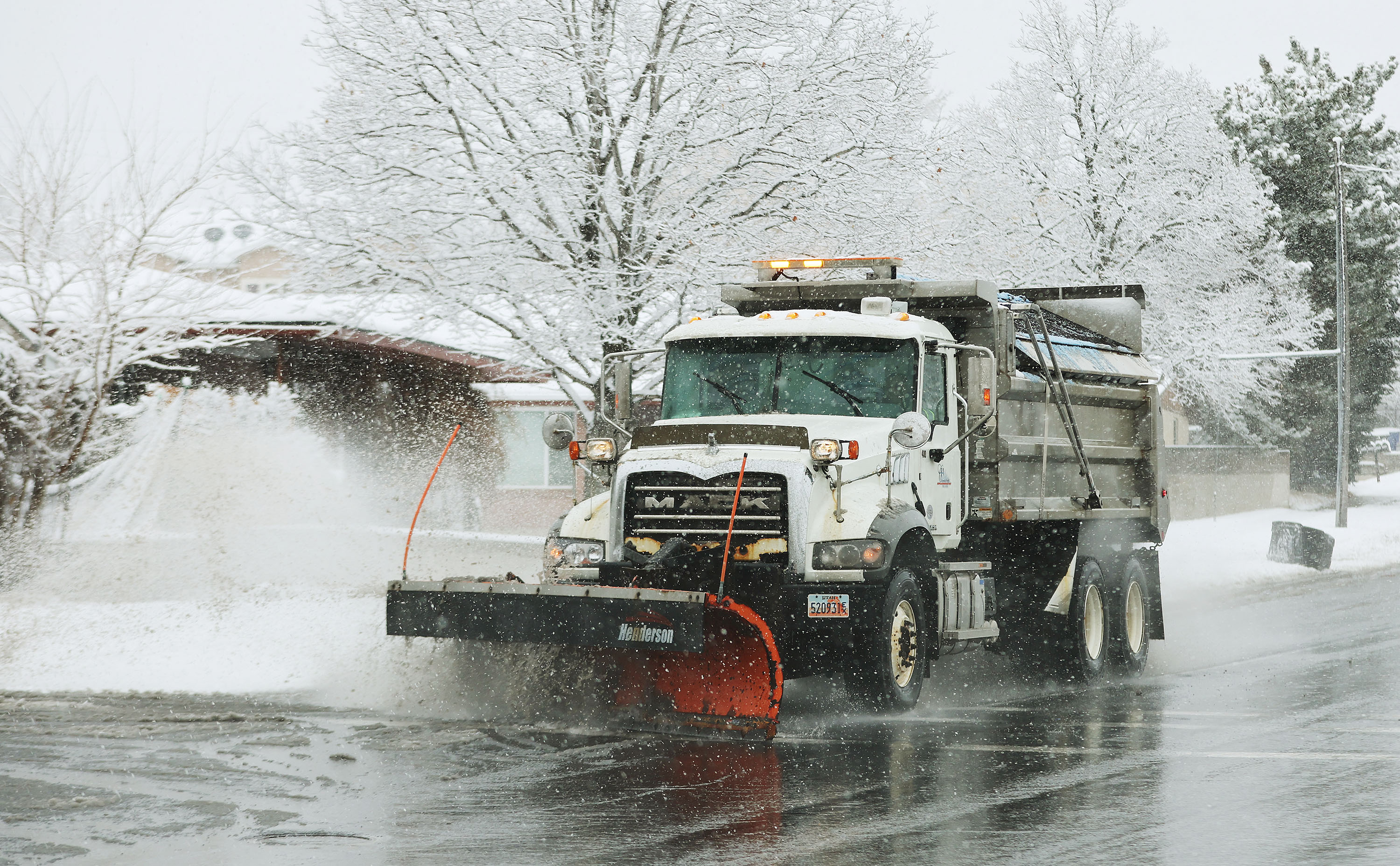 A Cottonwood Heights snowplow clears the road in Cottonwood Heights on Feb. 9. Forecasters are urging drivers across Utah to prepare for wet roads from Friday to Saturday, especially in the mountains.