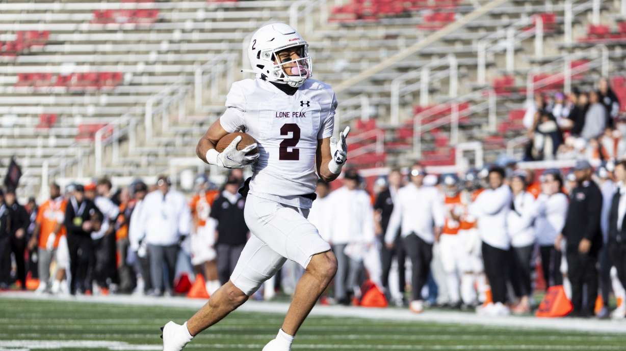 Lone Peak free safety Landan Goff (2) returns a punt for a touchdown during a 6A high school football semifinal game against Skyridge held at Rice-Eccles Stadium in Salt Lake City on Thursday, Nov. 14, 2024.