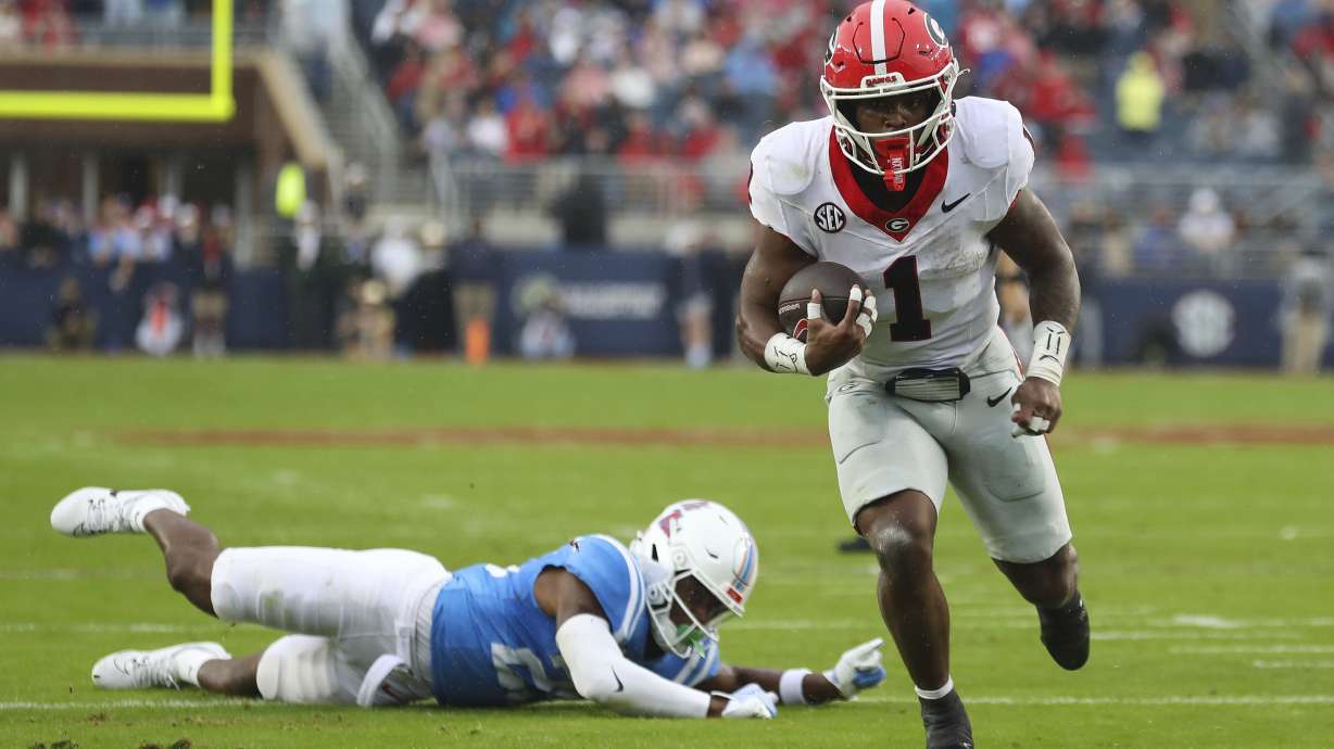 Georgia running back Trevor Etienne (1) runs the ball during the first half of an NCAA college football game against Mississippi on Saturday, Nov. 9, 2024, in Oxford, Miss.