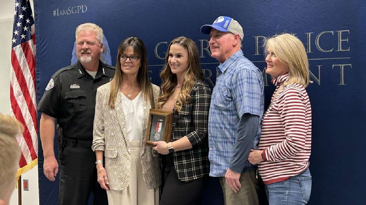 Group photo taken during Life Saving Award presented to 911 dispatcher Jenessa Thornton during a ceremony held at the St. George Police Department in St. George, Nov. 7.
