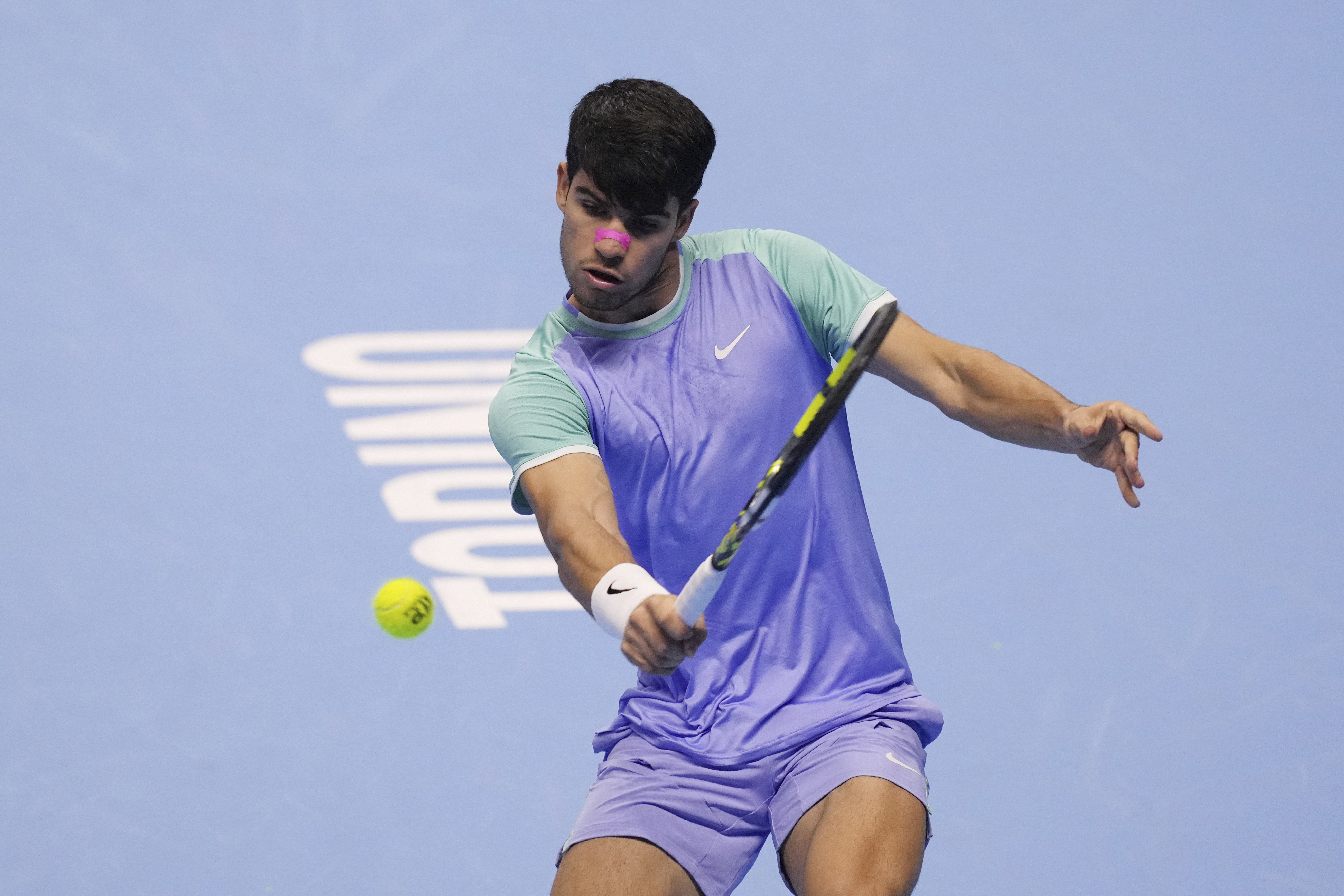 Spain's Carlos Alcaraz returns the ball to Germany's Alexander Zverev during their singles tennis match of the ATP World Tour Finals at the Inalpi Arena, in Turin, Italy, Friday, Nov. 15, 2024.