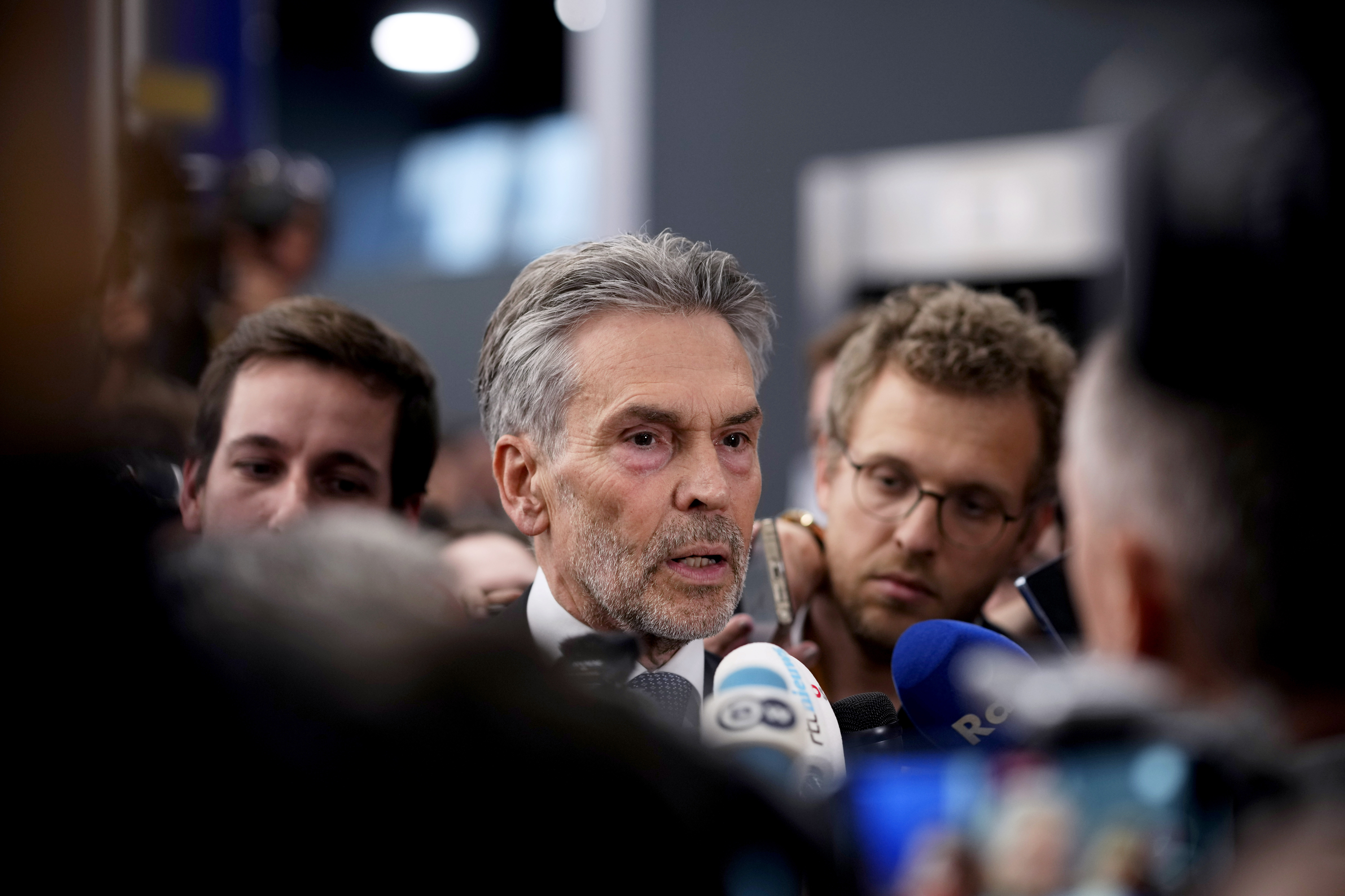 Netherland's Prime Minister Dick Schoof, center, speaks with journalists during an EU Summit at the Puskas Arena in Budapest, Hungary, Friday, Nov. 8, 2024.