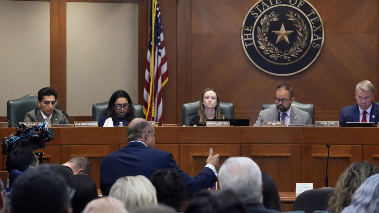 Dr. Phil McGraws, in blue suit gesturing with hand, makes comments during a committee hearing in the case of death row inmate Robert Roberson, Oct. 21 in Austin, Texas.
