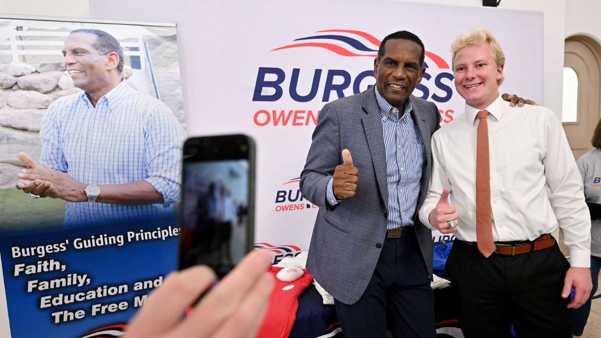 Rep. Burgess Owens, R-Utah, poses with Bryson Bawden while at a Utah GOP party in Draper on Nov. 5. Owens compared the results of the latest election to what it feels like winning an NFL Super Bowl.