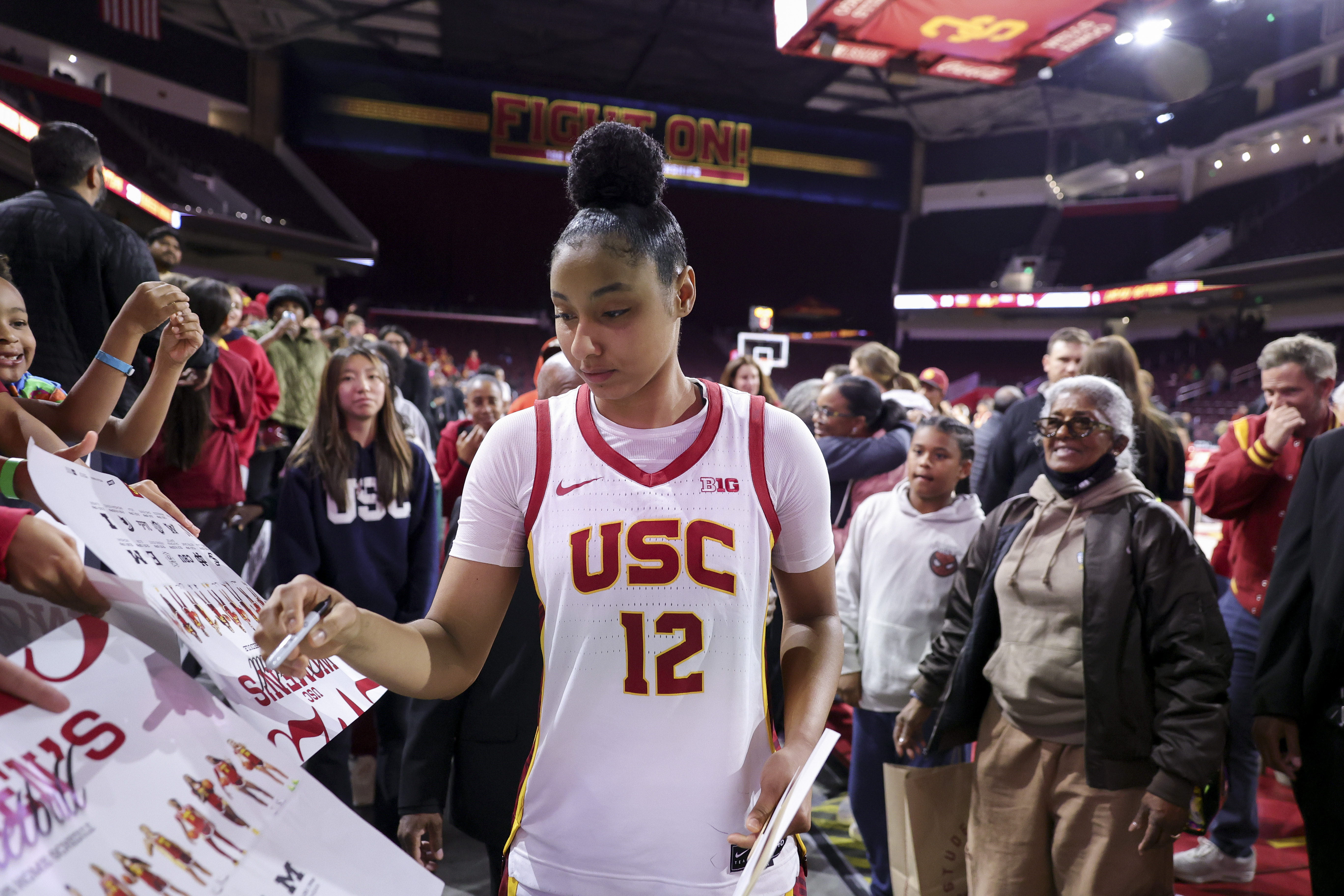 Southern California guard JuJu Watkins signs autographs after an NCAA women's basketball game against Cal State Northridge Tuesday, Nov. 12, 2024, in Los Angeles. 