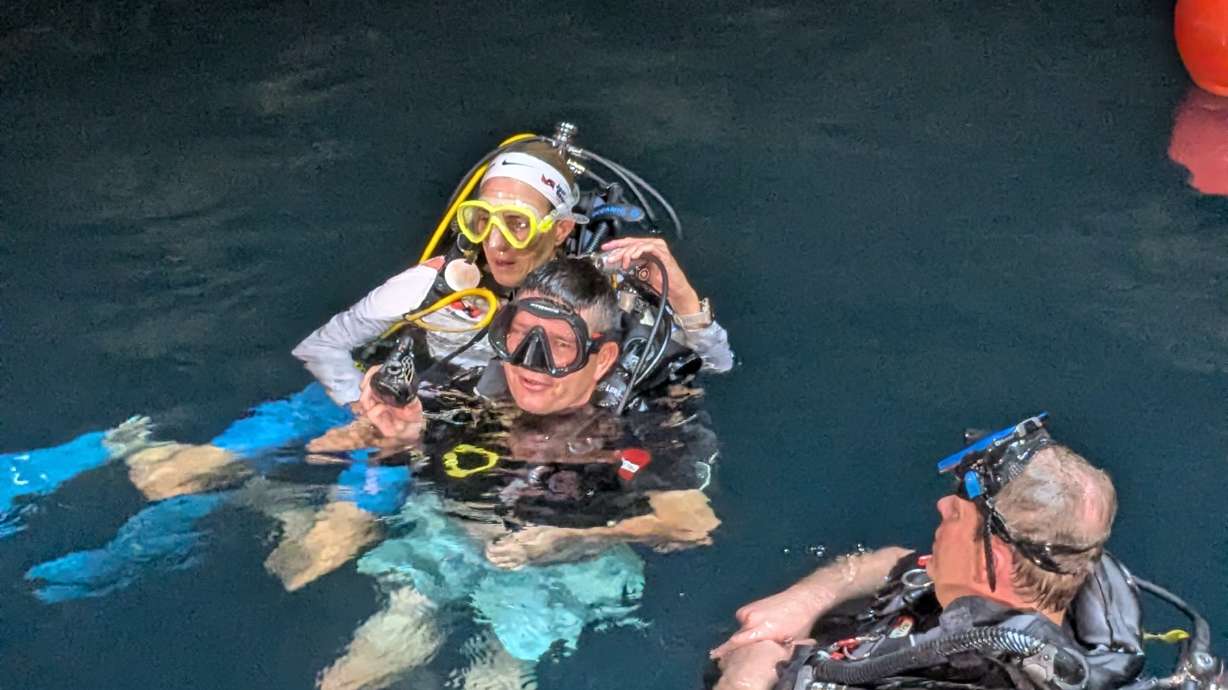 Nathan Ogden gains his scuba diving certification Friday morning at Homestead Crater in Midway. Two buddies — helpers — are with him. Ogden, who is paralyzed, worked with Just Breathe Adaptive to go through the certification process.
