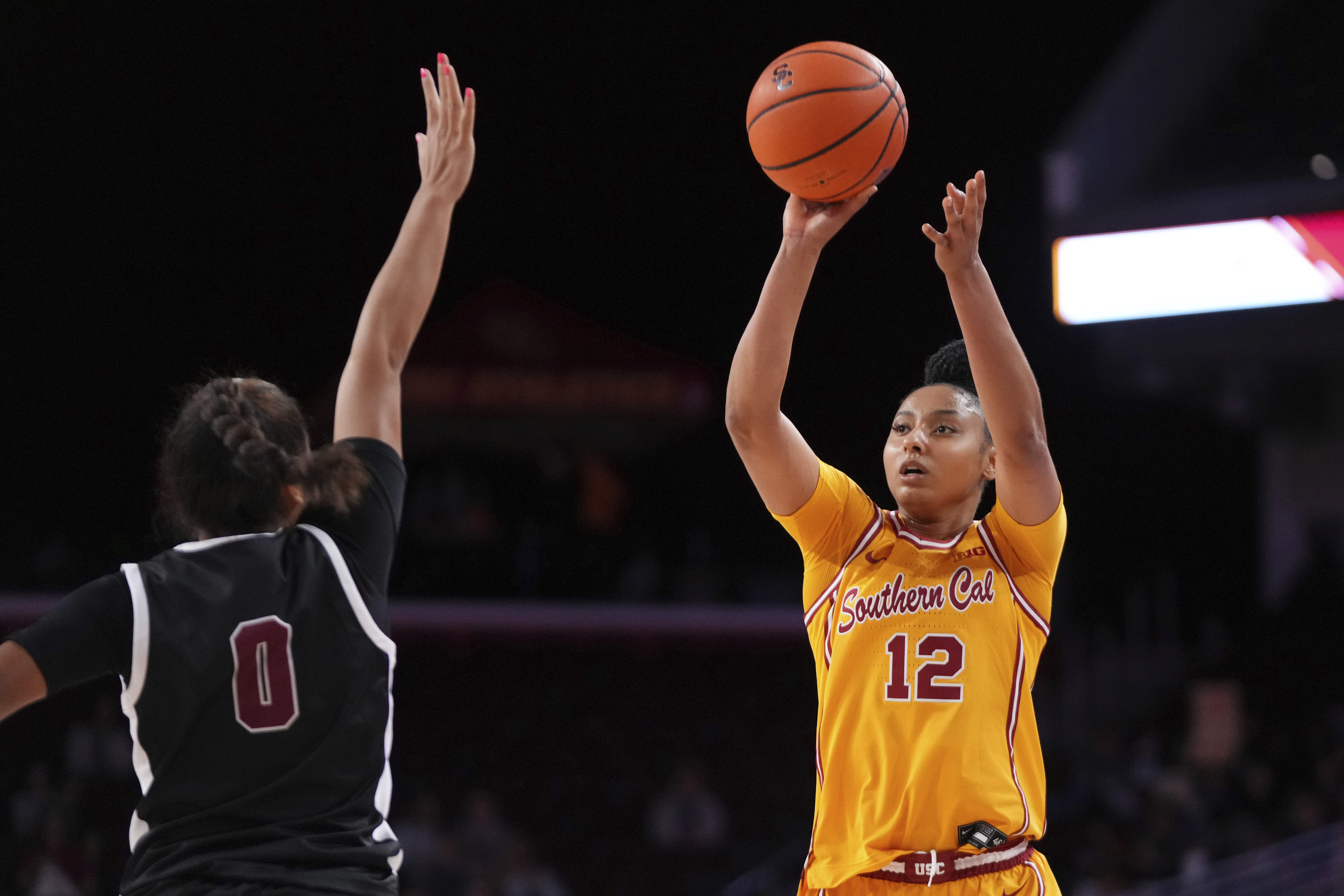 Southern California guard JuJu Watkins, right, shoots as Santa Clara guard Malia Latu defends during the second half of an NCAA college basketball game, Friday, Nov. 15, 2024, in Los Angeles. 