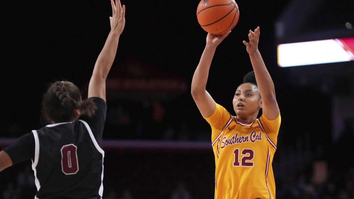 Southern California guard JuJu Watkins, right, shoots as Santa Clara guard Malia Latu defends during the second half of an NCAA college basketball game, Friday, Nov. 15, 2024, in Los Angeles.