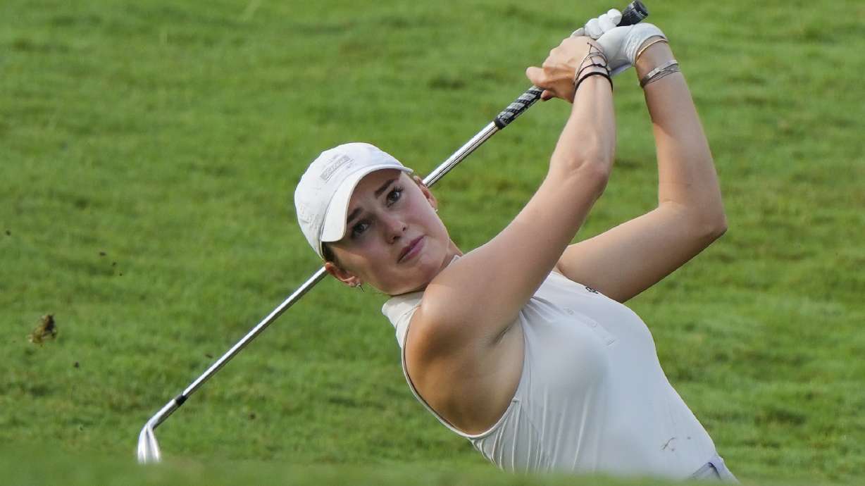 Nataliya Guseva of Russia hits from a fairway bunker at the 3rd fairway during the first round of Maybank LPGA Championship golf tournament at Kuala Lumpur Golf and Country club in Kuala Lumpur, Thursday, Oct. 24, 2024.