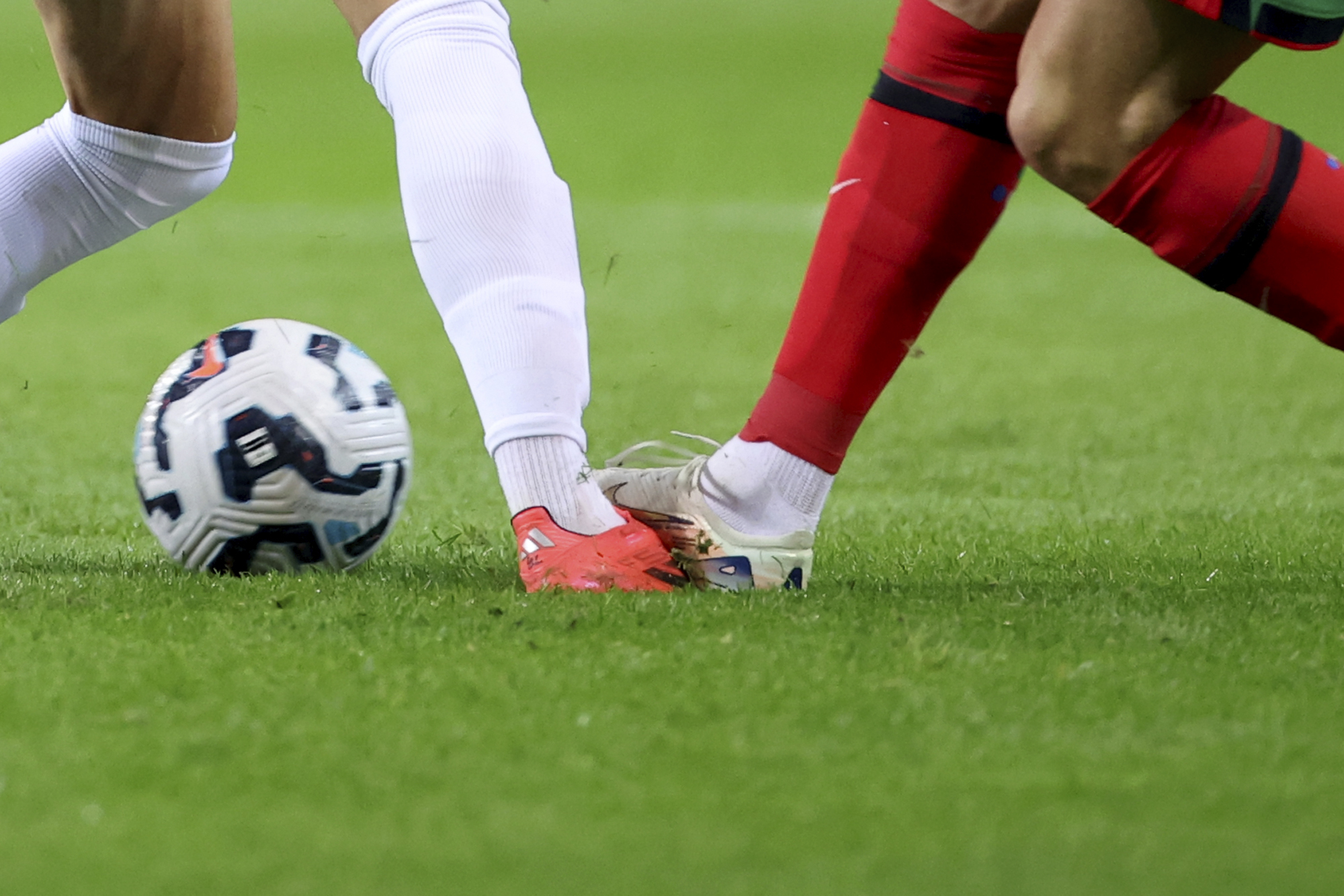 Portugal's Cristiano Ronaldo steps on the foot of Poland's Kacper Urbanski during the UEFA Nations League soccer match between Portugal and Poland at the Dragao stadium in Porto, Portugal, Friday, Nov. 15, 2024. 