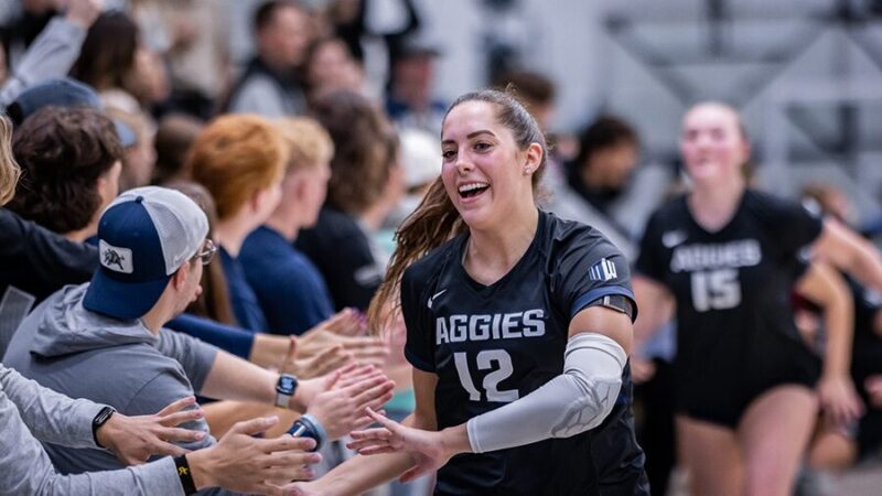 Kaylie Ray interacts with fans of Utah State volleyball in this undated image.