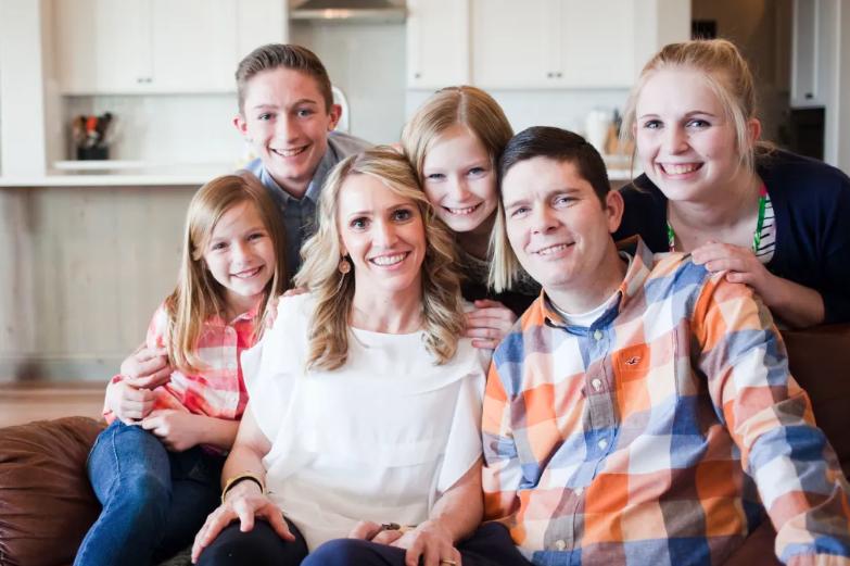 Nathan Ogden, of Boise, with his wife, Heather, and their four children. He was paralyzed after breaking his neck twice but hasn't let it slow him down.