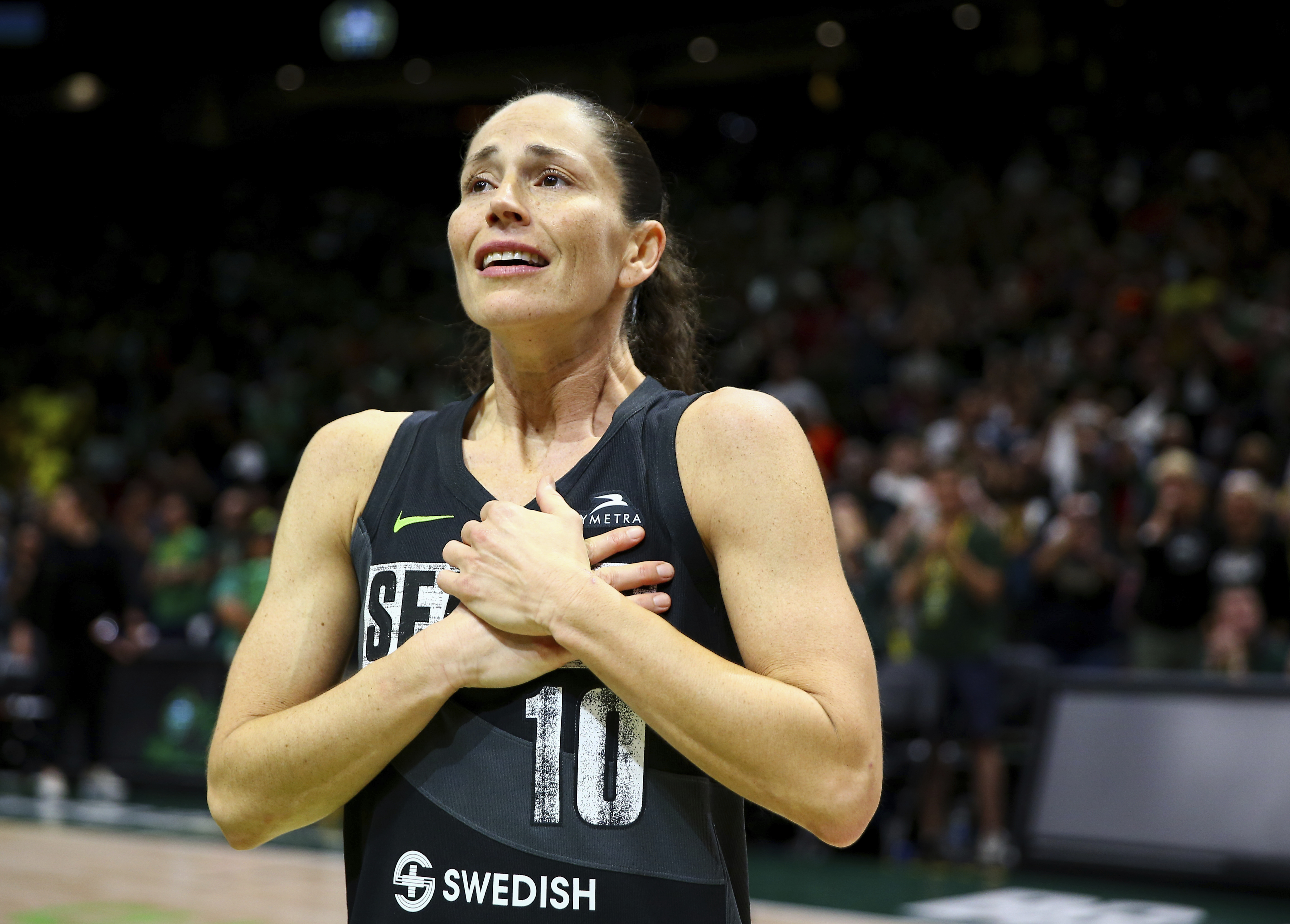 FILE - Seattle Storm guard Sue Bird reacts to fans chanting "Thank you Sue" after the Storm were eliminated from the playoffs with a loss in Game 4 of a WNBA basketball playoff semifinal to the Las Vegas Aces, Tuesday, Sept. 6, 2022, in Seattle.