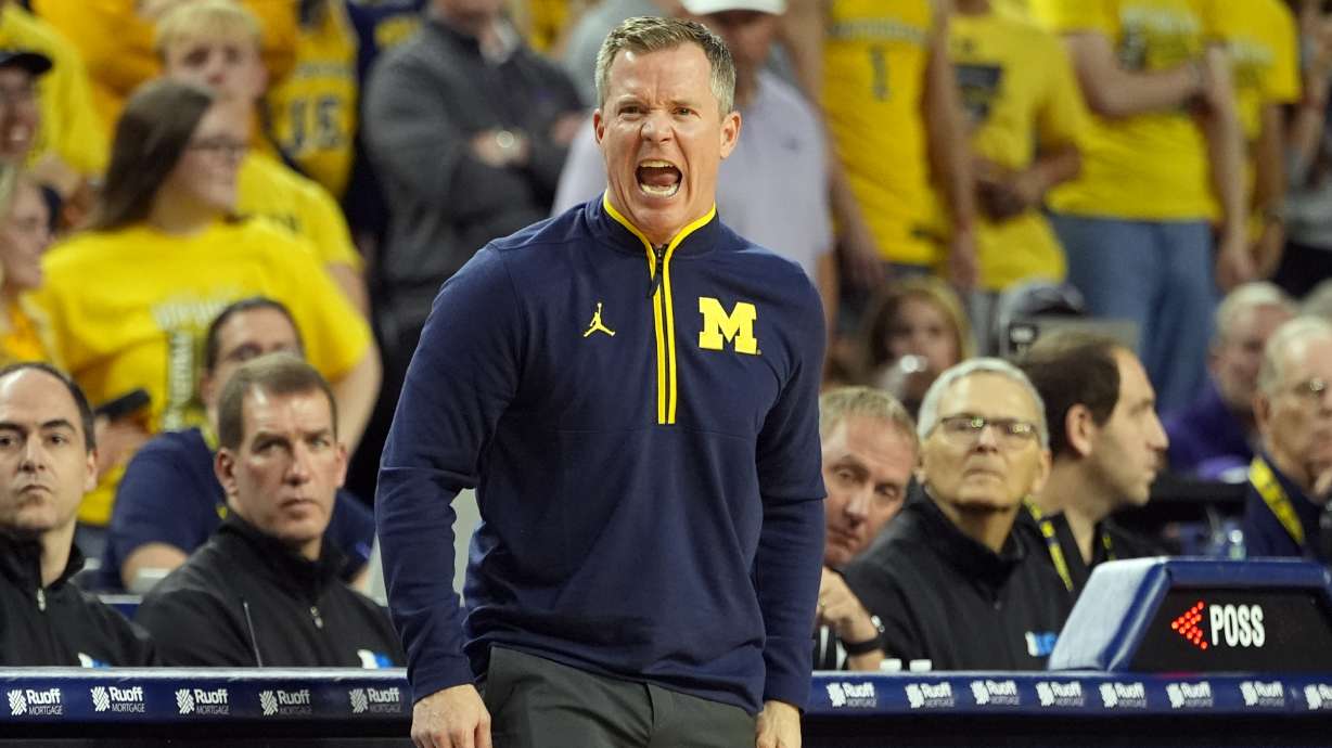 Michigan head coach Dusty May yells during the first half of an NCAA college basketball game against TCU, Friday, Nov. 15, 2024, in Ann Arbor, Mich.