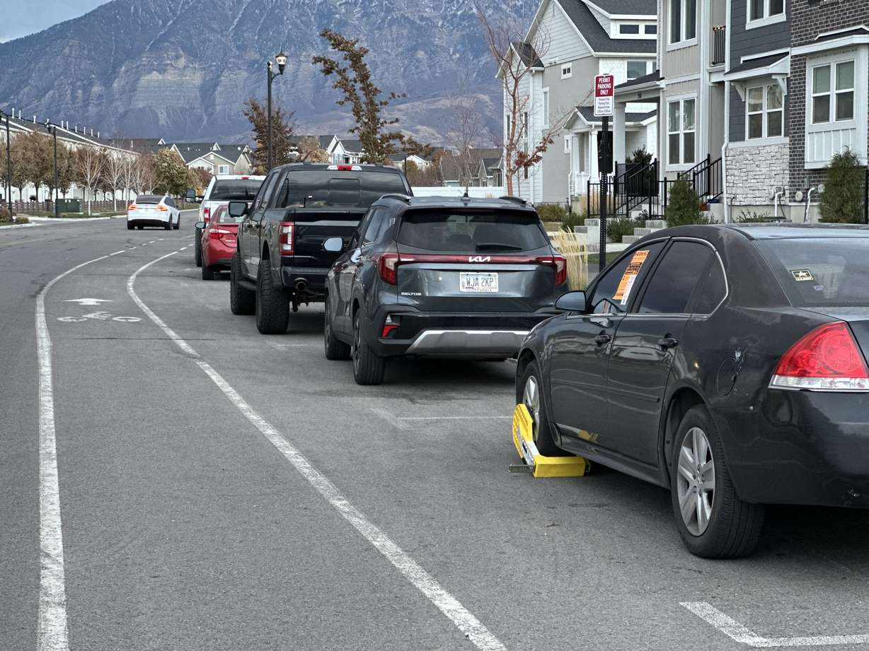 A booted car is parked along Vineyard Loop Road in Vineyard on Friday.
