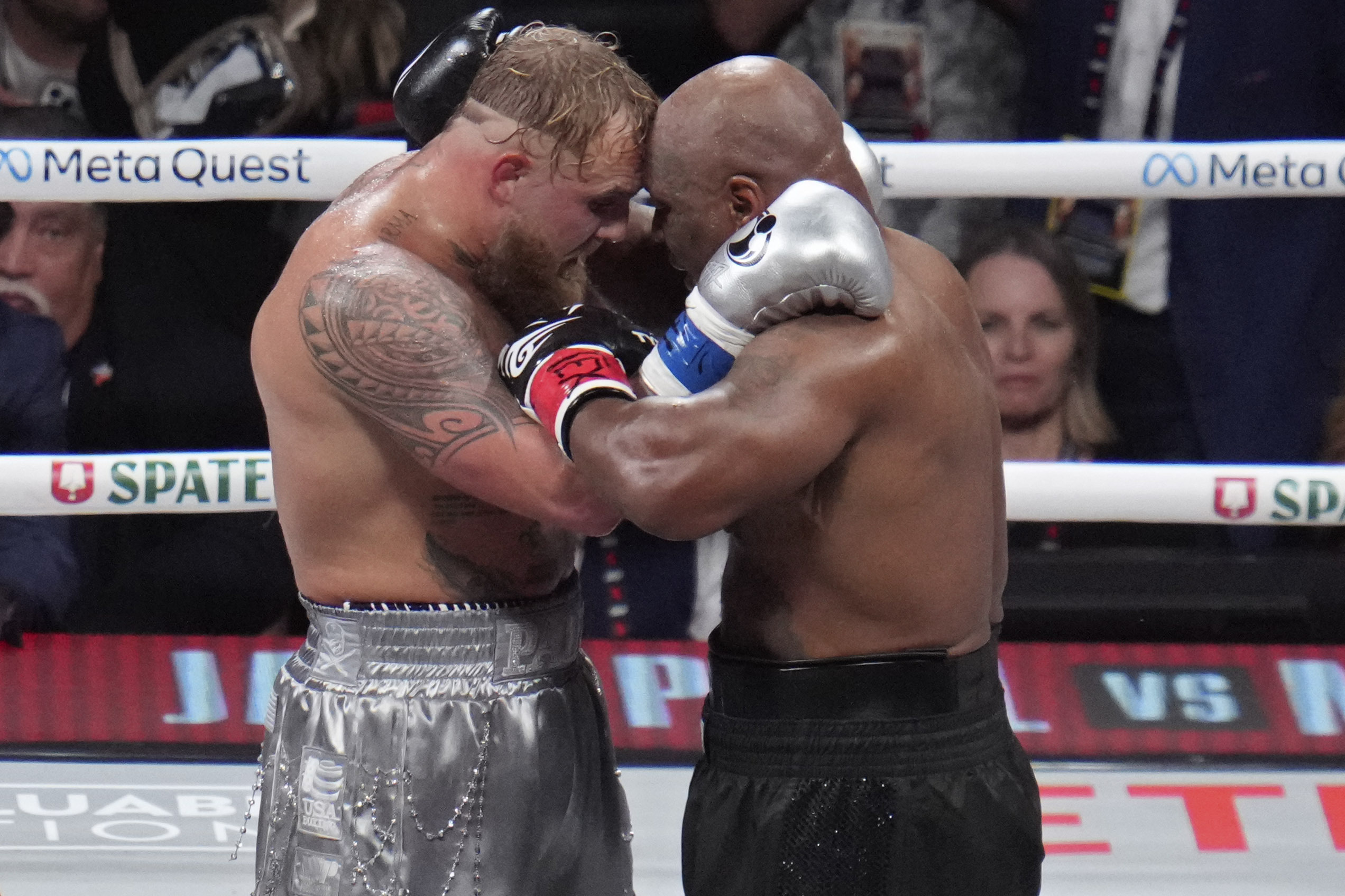 Jake Paul and Mike Tyson embrace after their heavyweight boxing match, Friday, Nov. 15, 2024, in Arlington, Texas. 