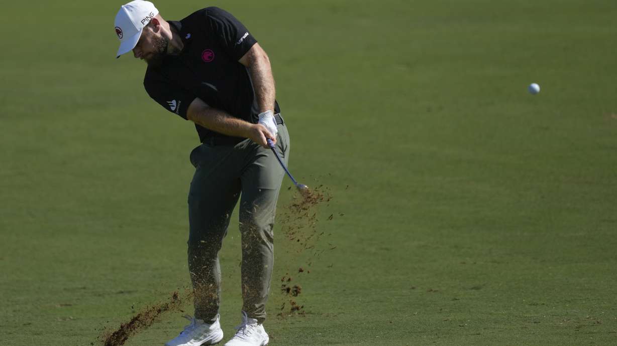 Tyrell Hatton of England plays his second shot on the 2nd hole during the second round of World Tour Golf Championship in Dubai, United Arab Emirates, Saturday, Nov. 16, 2024.