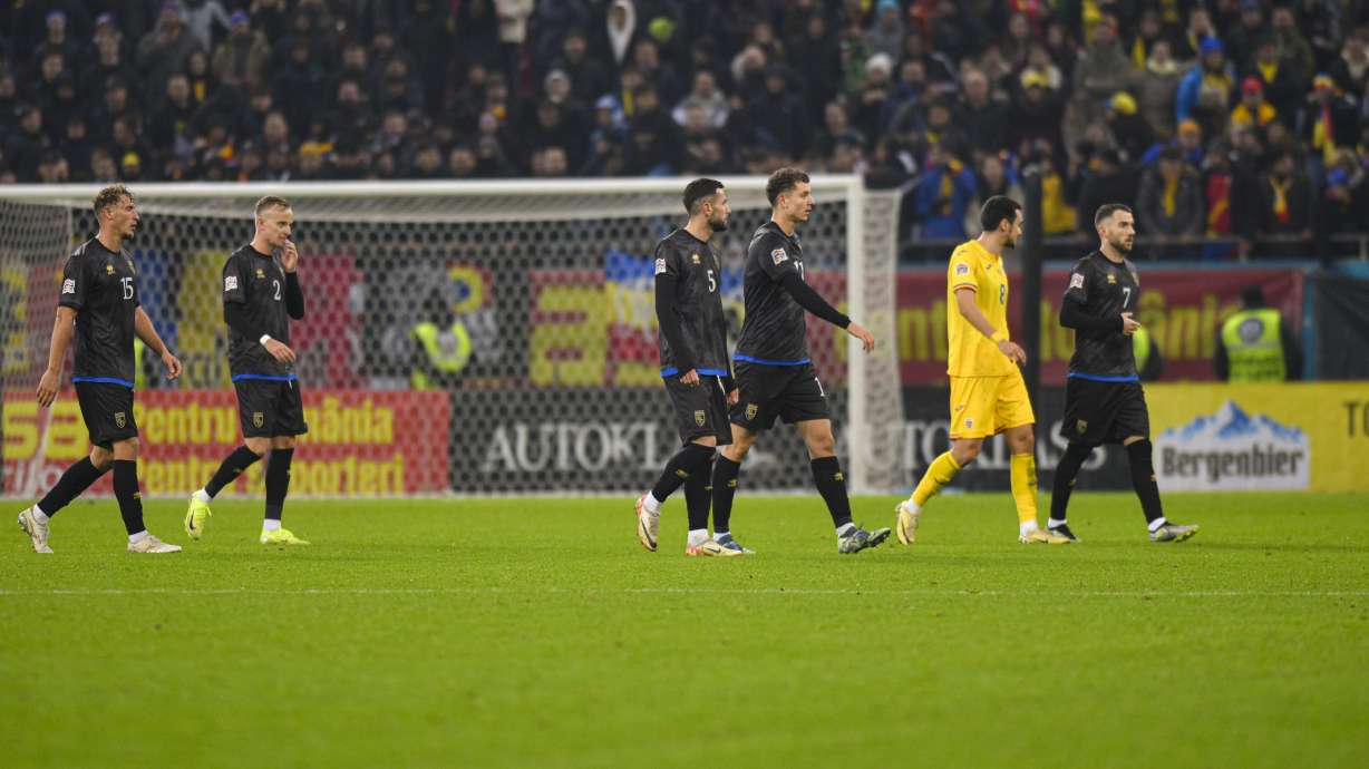 Kosovo players leave the pitch during the UEFA Nations League soccer match between Romania and Kosovo at the National Arena stadium in Bucharest, Romania, Saturday, Nov. 16, 2024.