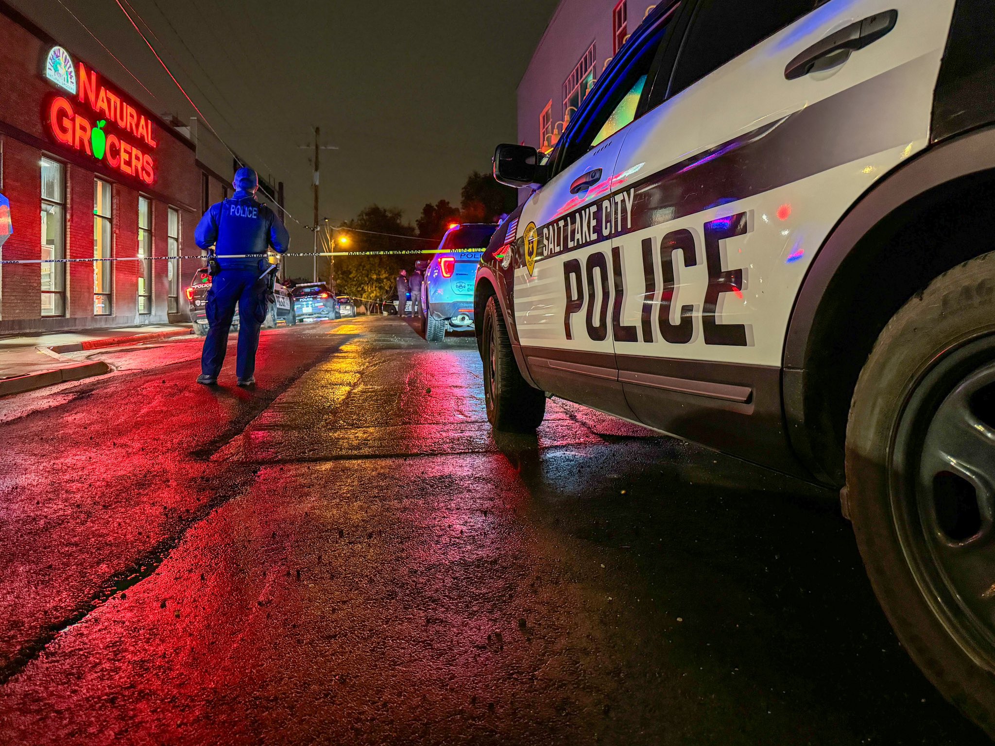 An officer with the Salt Lake City Police Department secures a crime scene near 1045 E. 2100 South after a deadly shooting early Saturday.