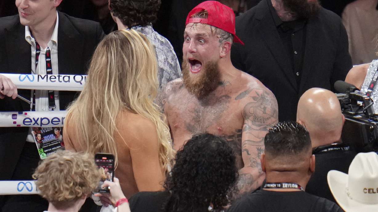 Jake Paul reacts after defeating Mike Tyson during their heavyweight boxing match, Friday, Nov. 15, 2024, in Arlington, Texas.