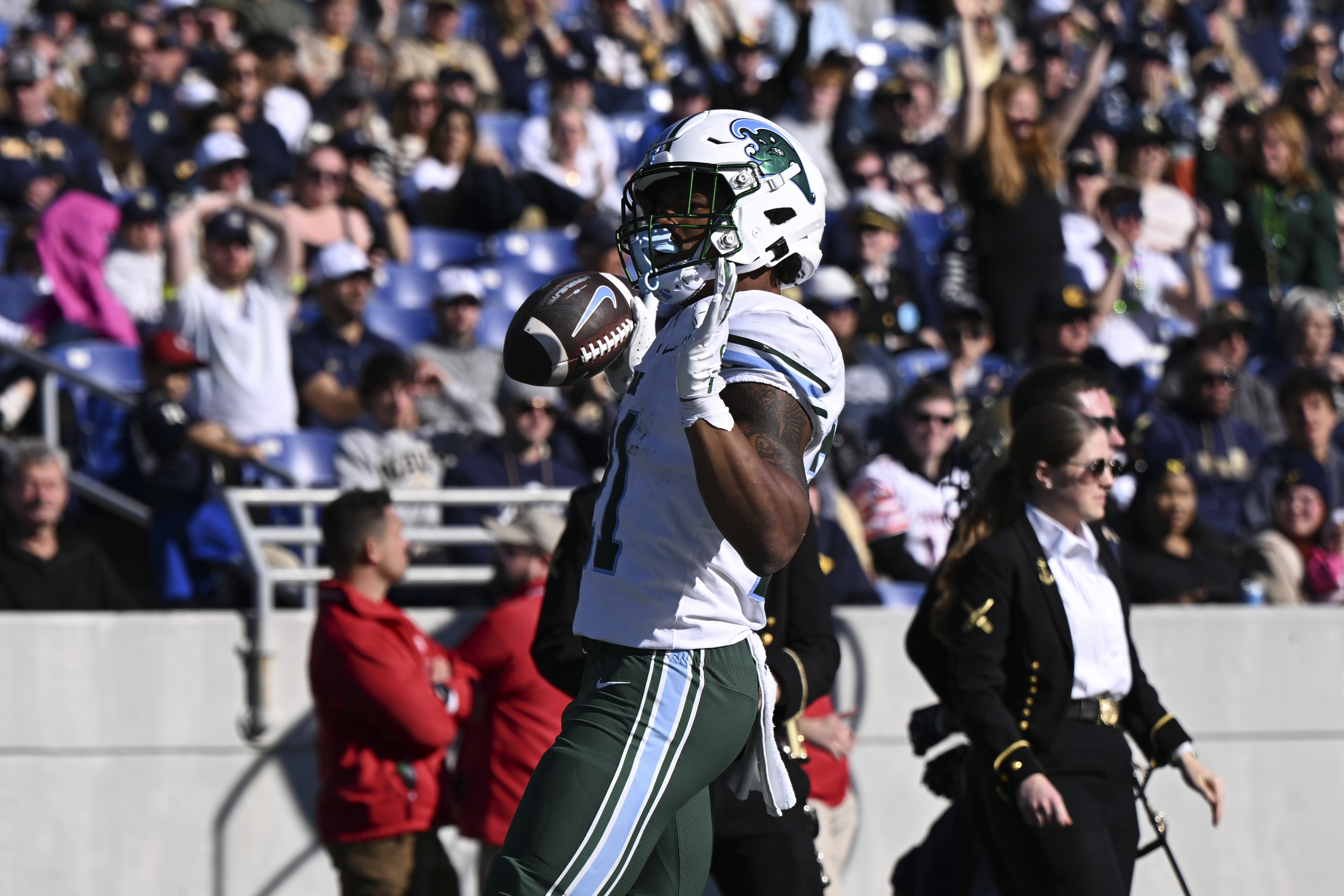 Tulane running back Makhi Hughes celebrates after scoring a touchdown during the first half of an NCAA college football game against Navy, Saturday, Nov. 16, 2024, in Annapolis, Md. 