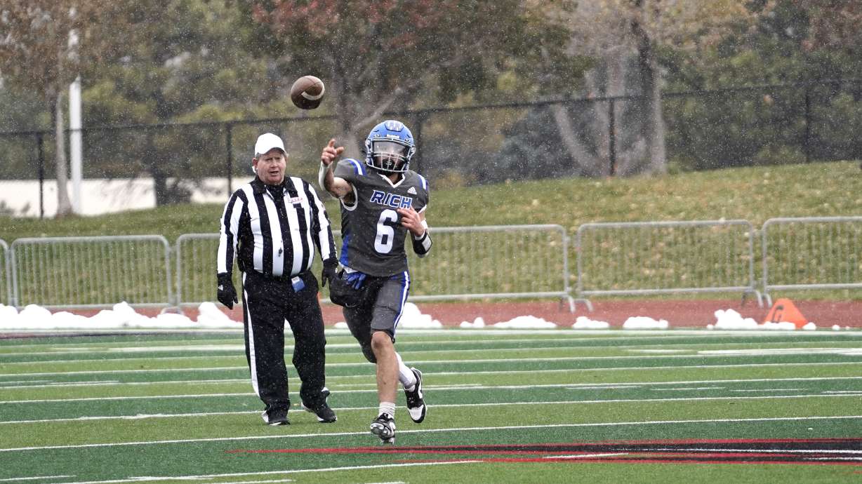 Rich's Jett Holmes throws on the run.