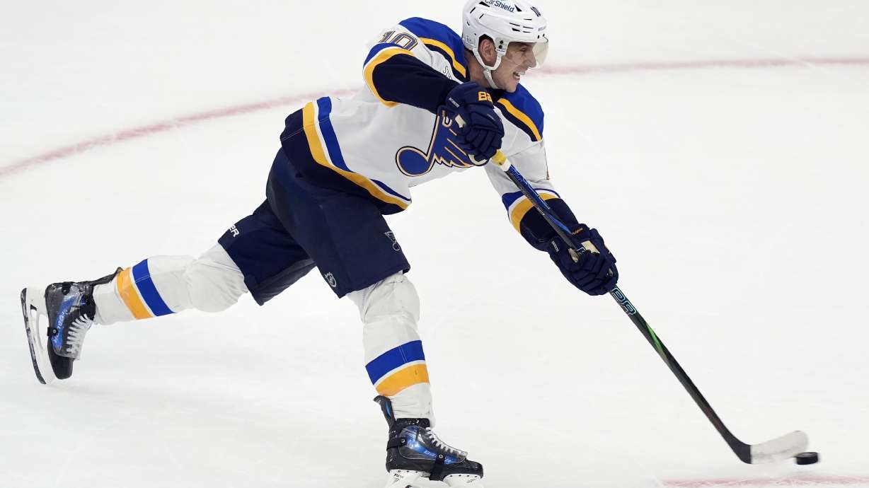 St. Louis Blues' Brayden Schenn scores the game-winning goal during overtime in an NHL hockey game against the Boston Bruins, Saturday, Nov. 16, 2024, in Boston.