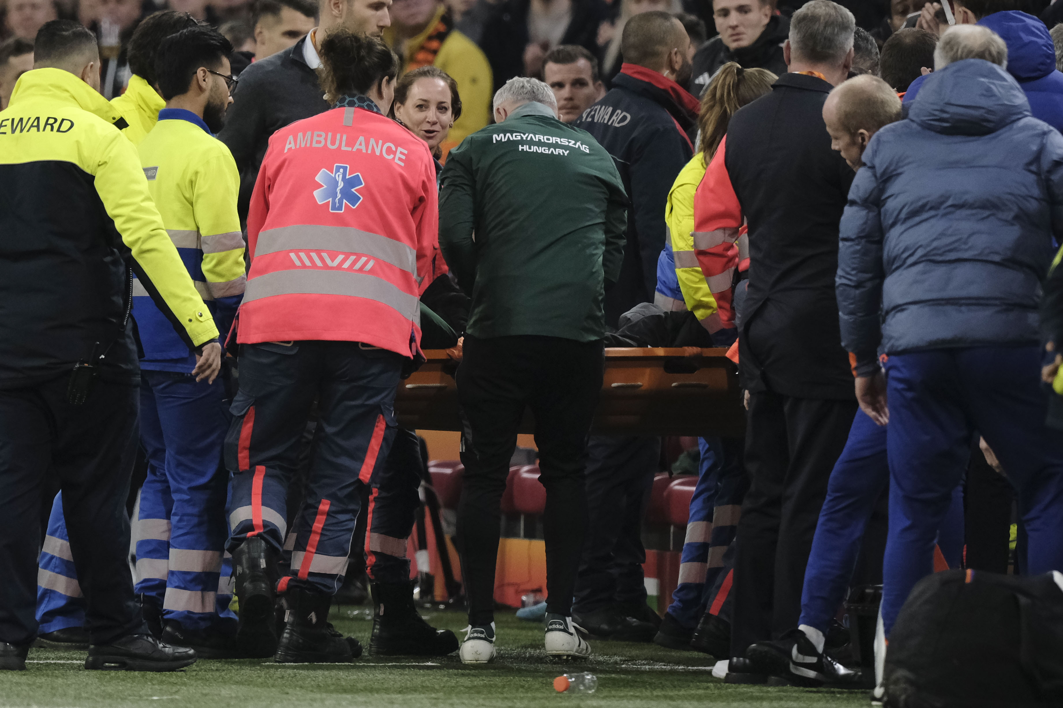 Medics carry Hungary's assistant coach Adam Szalai from the pitch during the UEFA Nations League soccer match between Netherlands and Hungary, at the Johan Cruyff ArenA, in Amsterdam, Netherlands, Saturday, Nov. 16, 2024. 