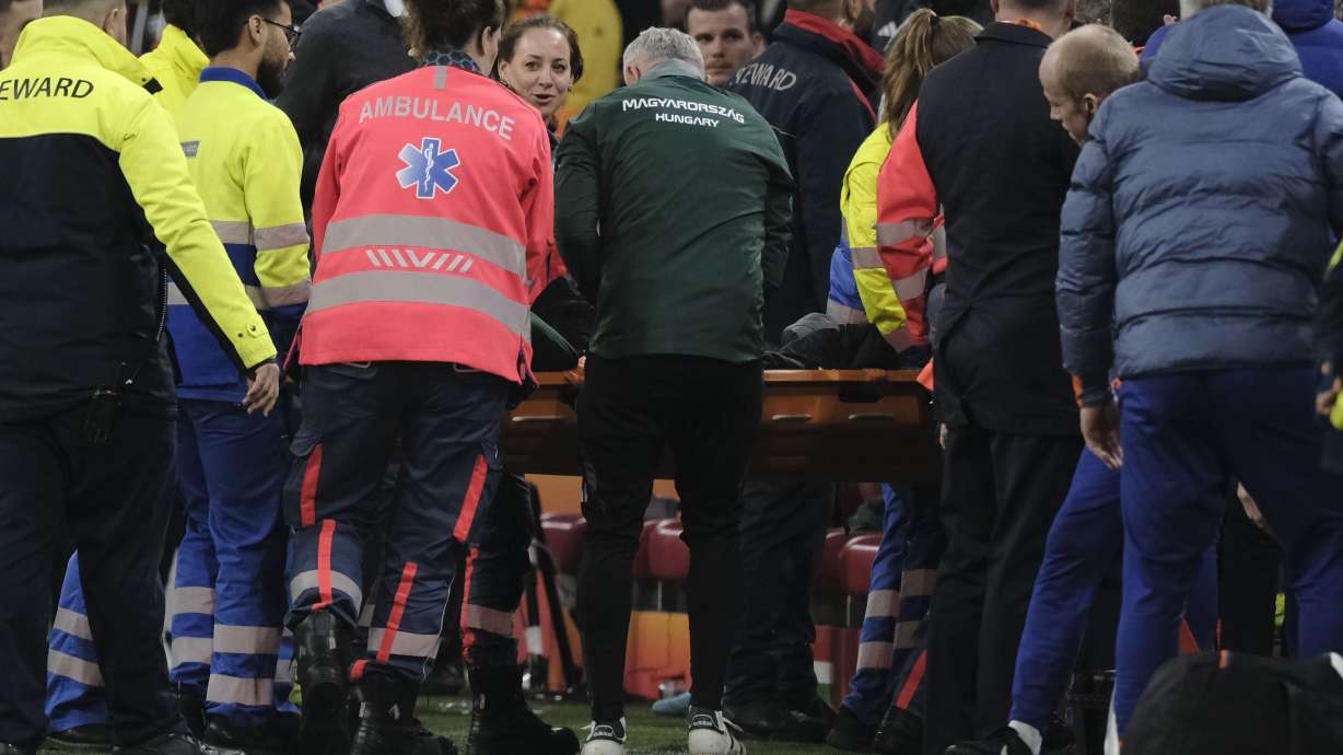 Medics carry Hungary's assistant coach Adam Szalai from the pitch during the UEFA Nations League soccer match between Netherlands and Hungary, at the Johan Cruyff ArenA, in Amsterdam, Netherlands, Saturday, Nov. 16, 2024.