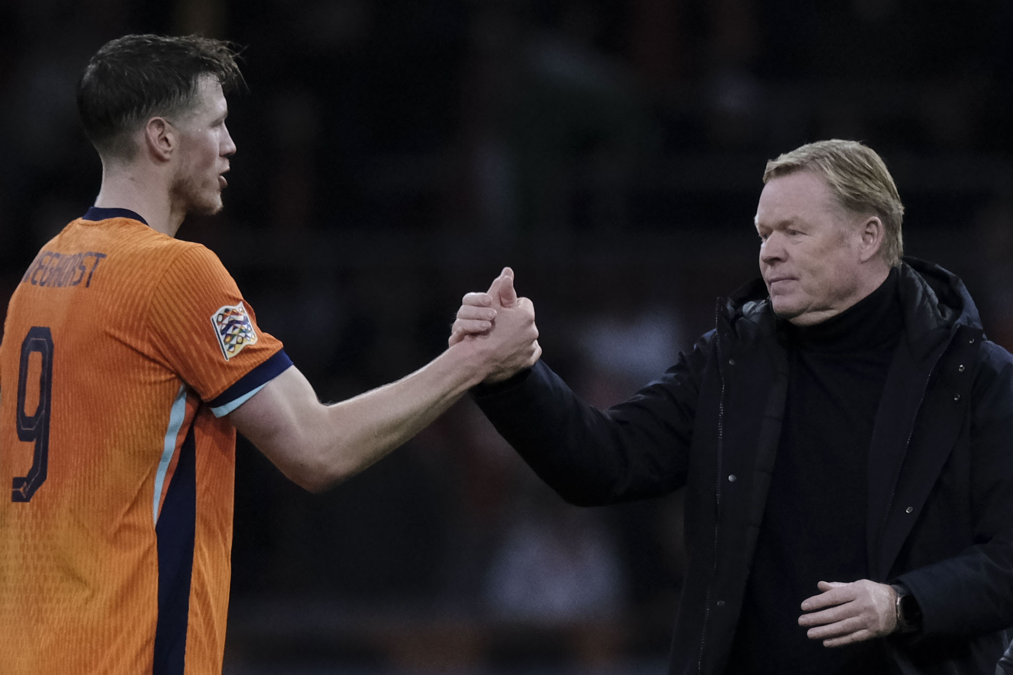 Ronald Koeman, head coach of the Netherlands, right shakes hands with Wout Weghorst of the Netherlands at the end of the UEFA Nations League soccer match between Netherlands and Hungary, at the Johan Cruyff ArenA, in Amsterdam, Netherlands, Saturday, Nov. 16, 2024. 