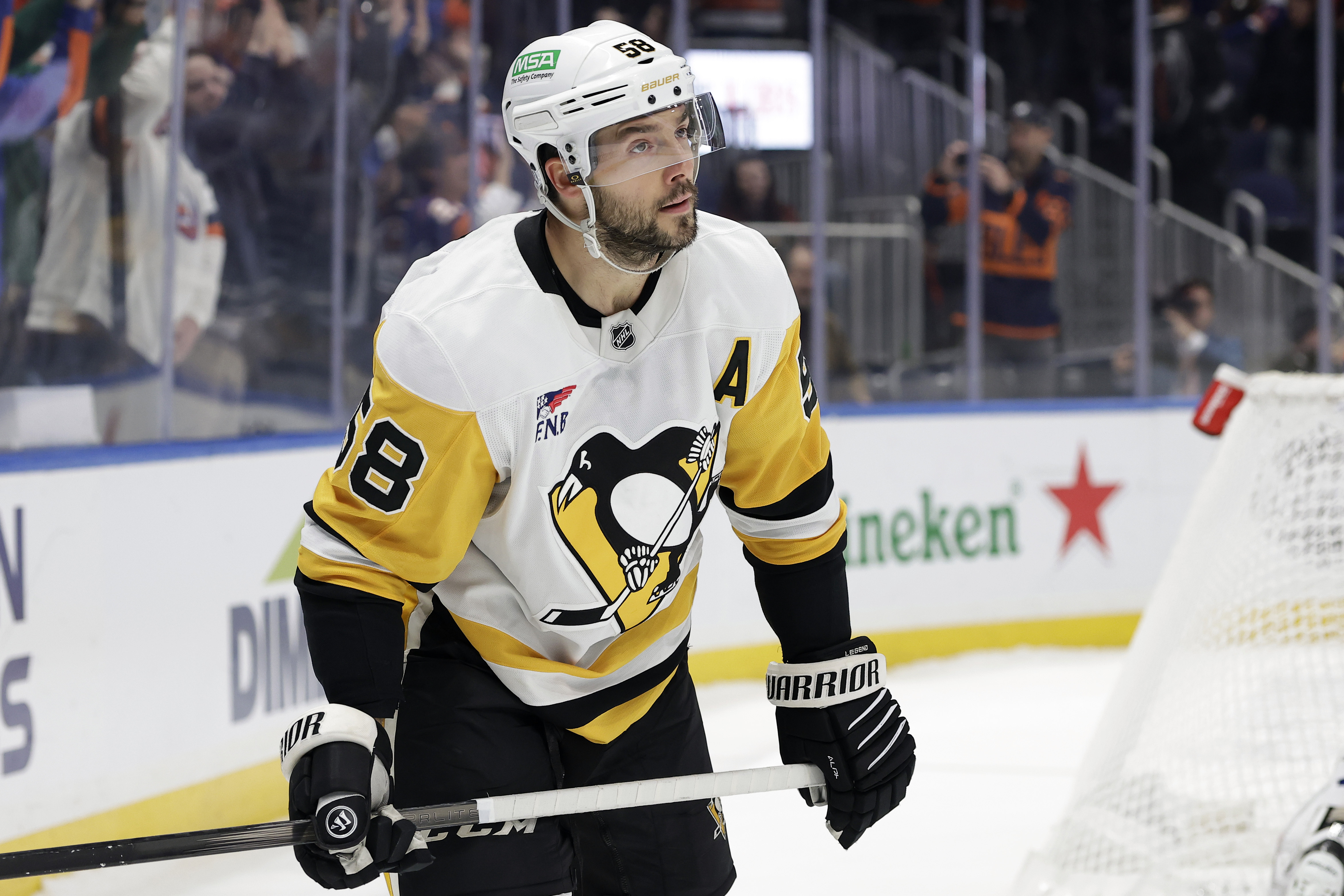 Pittsburgh Penguins defenseman Kris Letang reacts after missing his shot during a shootout in an NHL hockey game against the New York Islanders Tuesday, Nov. 5, 2024, in Elmont, N.Y. The Islanders won 4-3 in a shootout. 