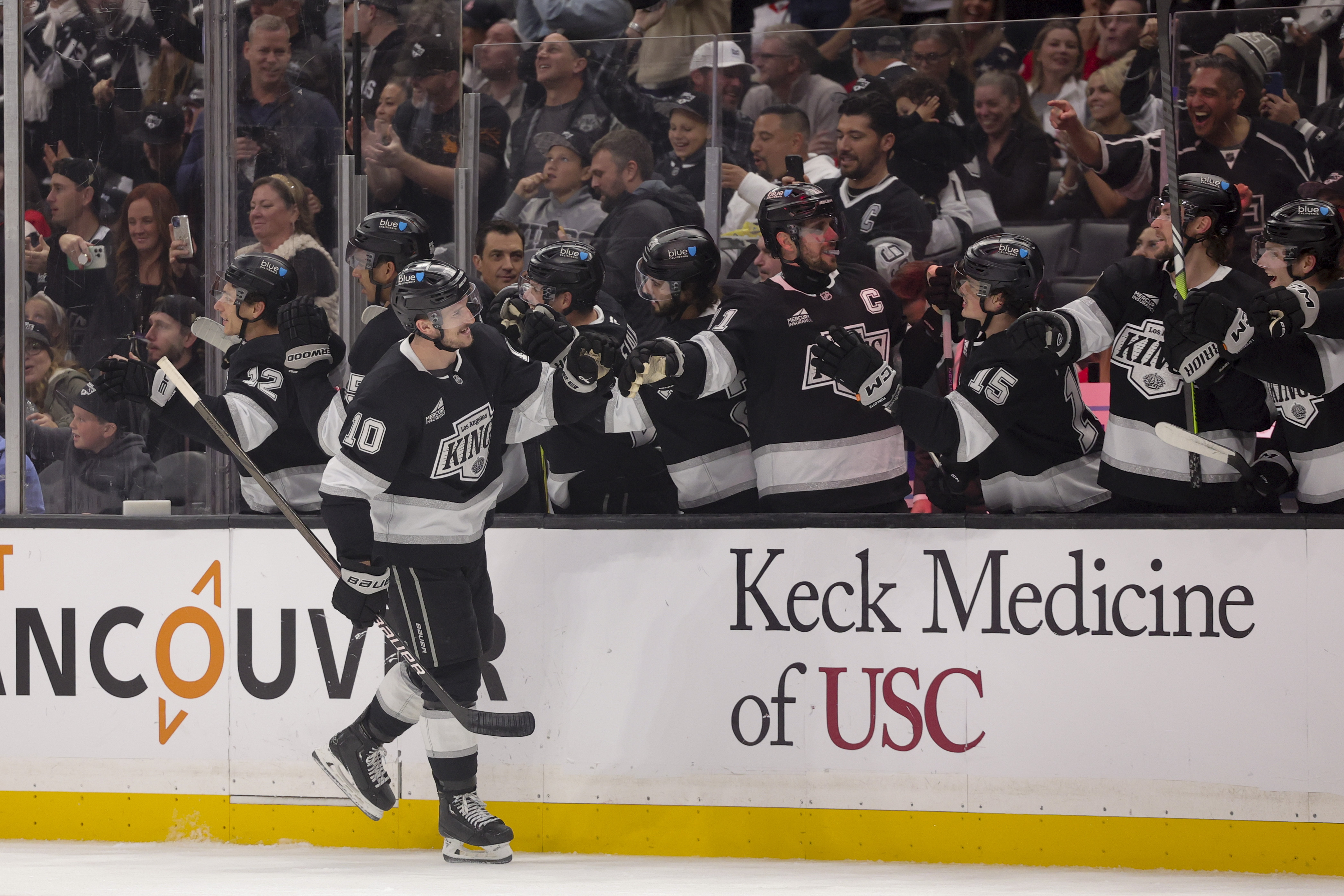 Los Angeles Kings left wing Tanner Jeannot celebrates with the bench after scoring during the first period of an NHL hockey game against the Detroit Red Wings, Saturday, Nov. 16, 2024, in Los Angeles. 