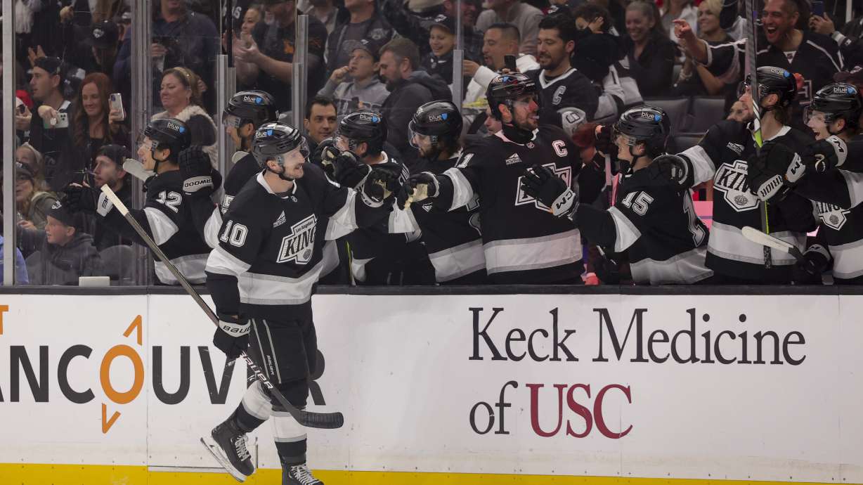 Los Angeles Kings left wing Tanner Jeannot celebrates with the bench after scoring during the first period of an NHL hockey game against the Detroit Red Wings, Saturday, Nov. 16, 2024, in Los Angeles.