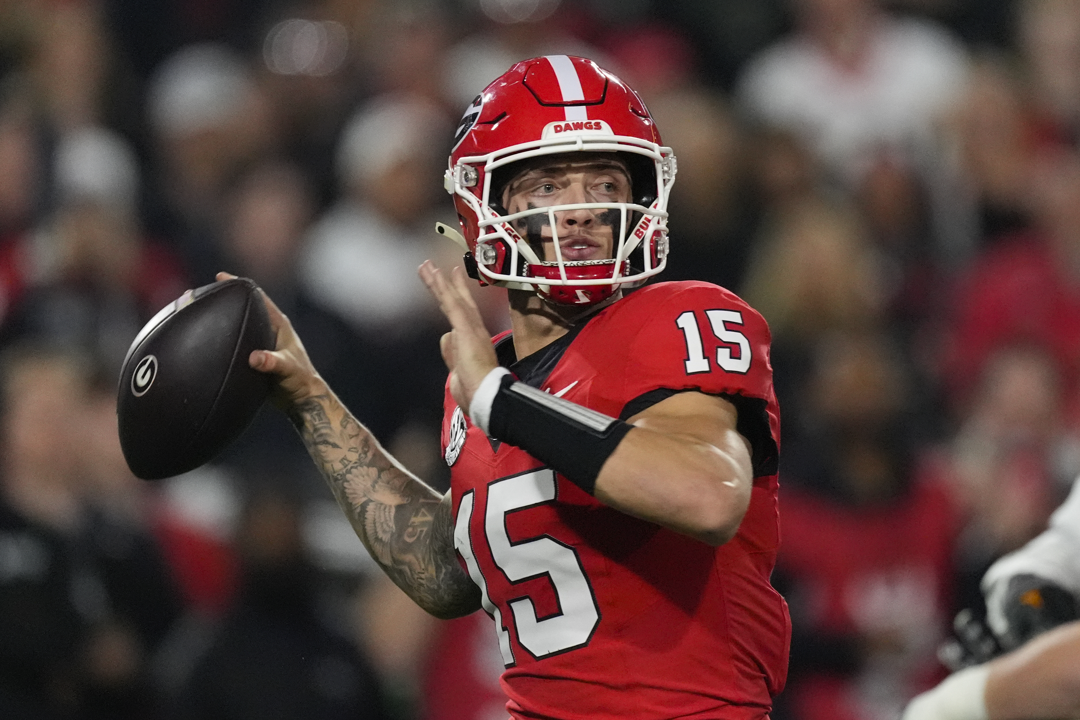 Georgia quarterback Carson Beck (15) looks for an open receiver during the first half of an NCAA college football game against Tennessee, Saturday, Nov. 16, 2024, in Athens, Ga.