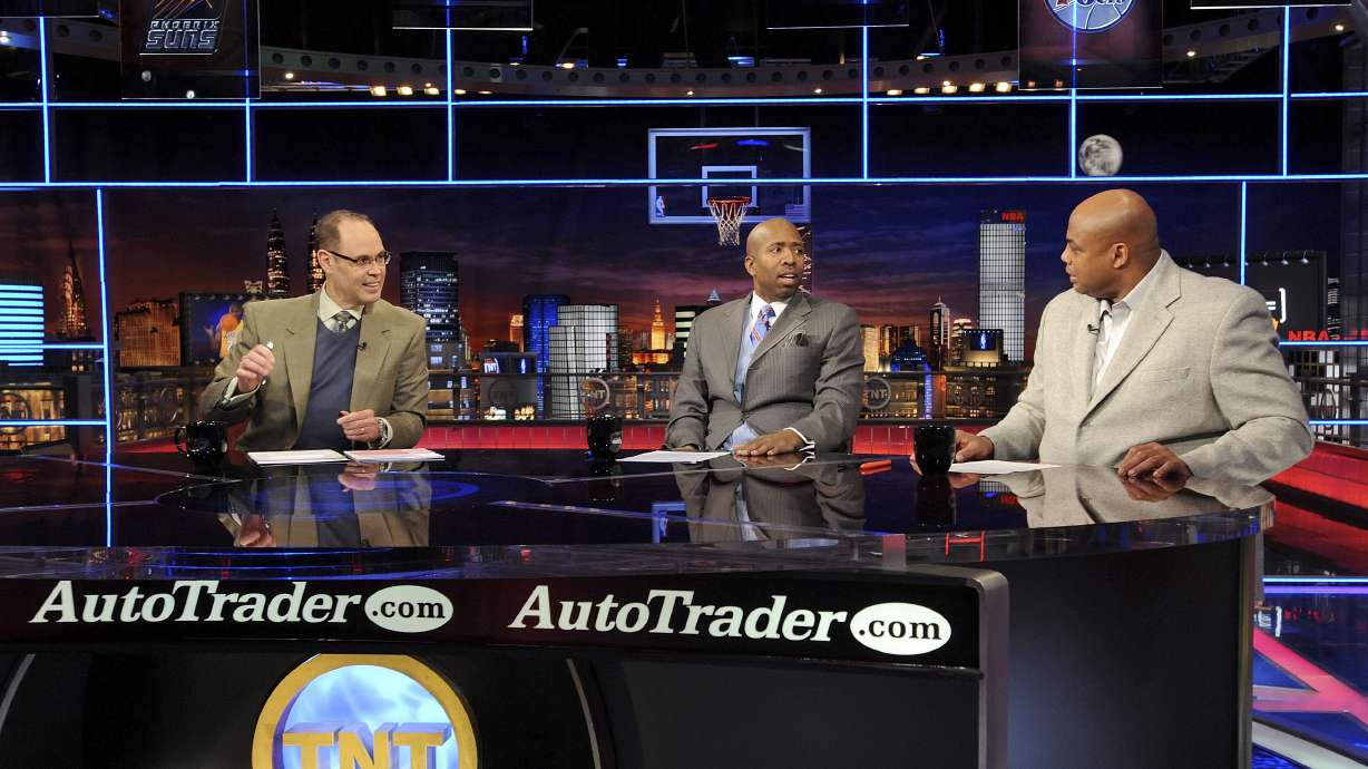 FILE - Inside the NBA host Ernie Johnson Jr., left, and analysts Kenny Smith, center, and Charles Barkley speak on the set at the TNT studios in Atlanta, Feb. 4, 2010.